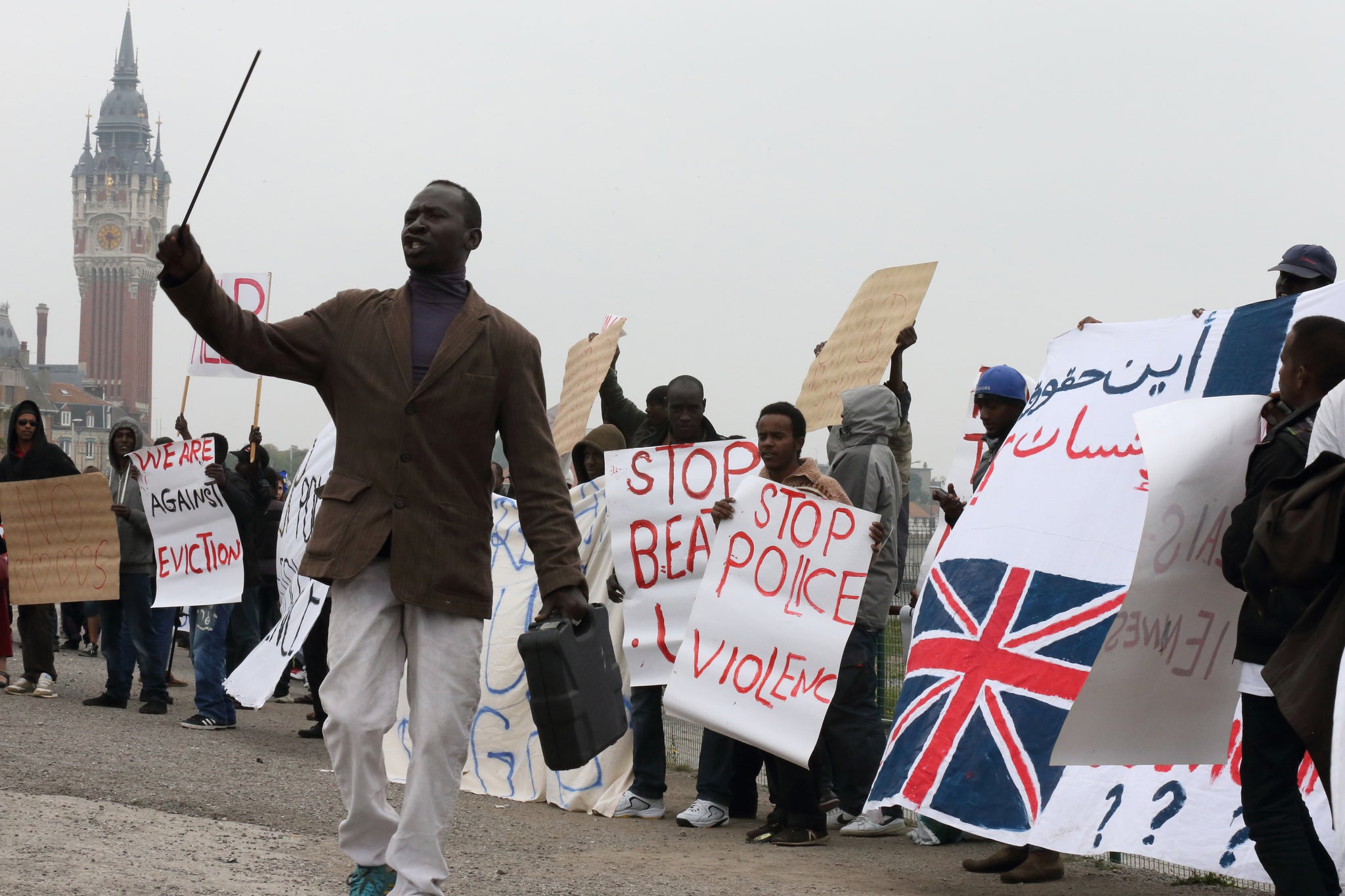 Migrants from Africa demonstrate in front of the Calais city hall yesterday