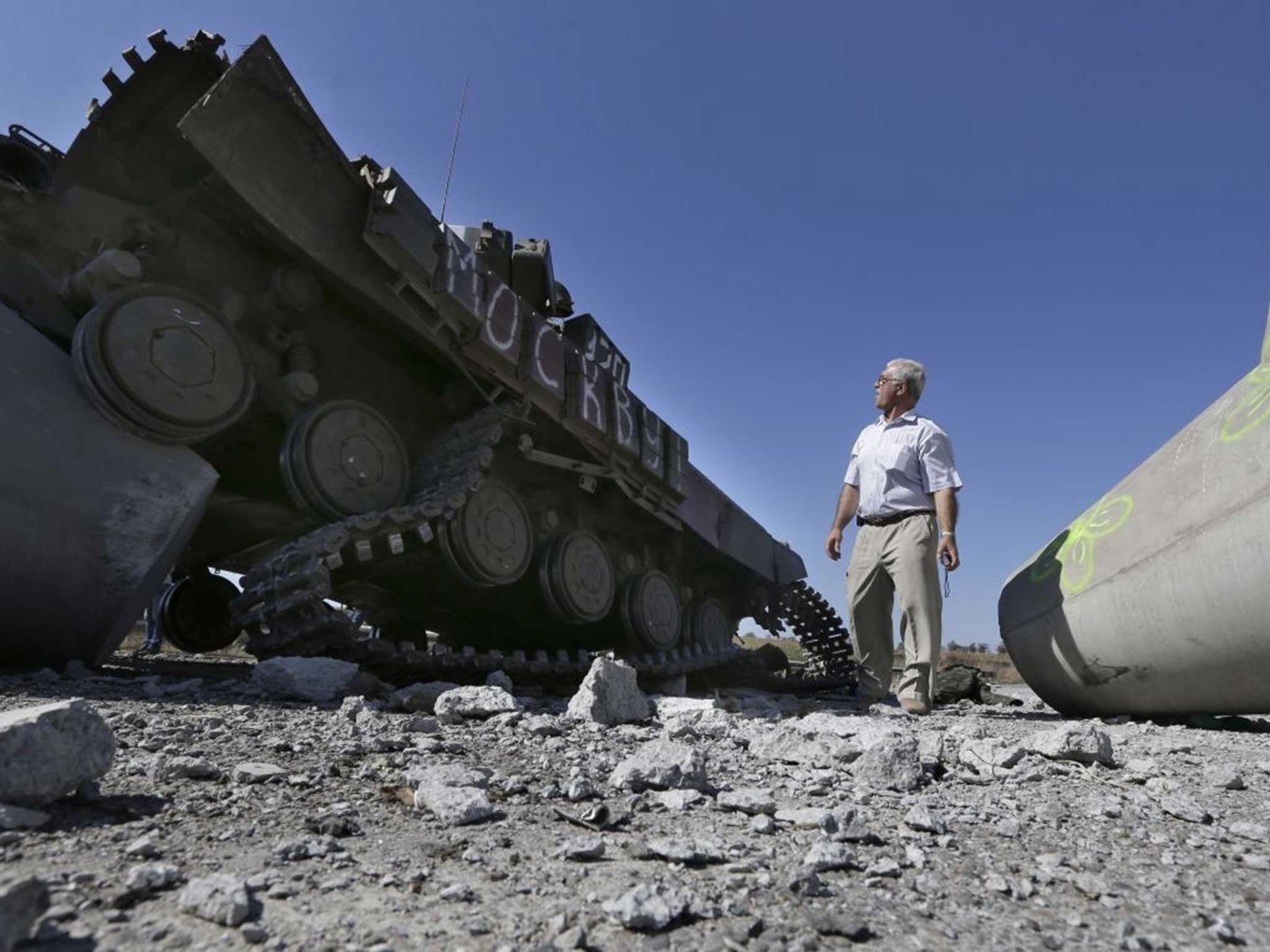 Peacetime: A wrecked tank in eastern Ukraine yesterday