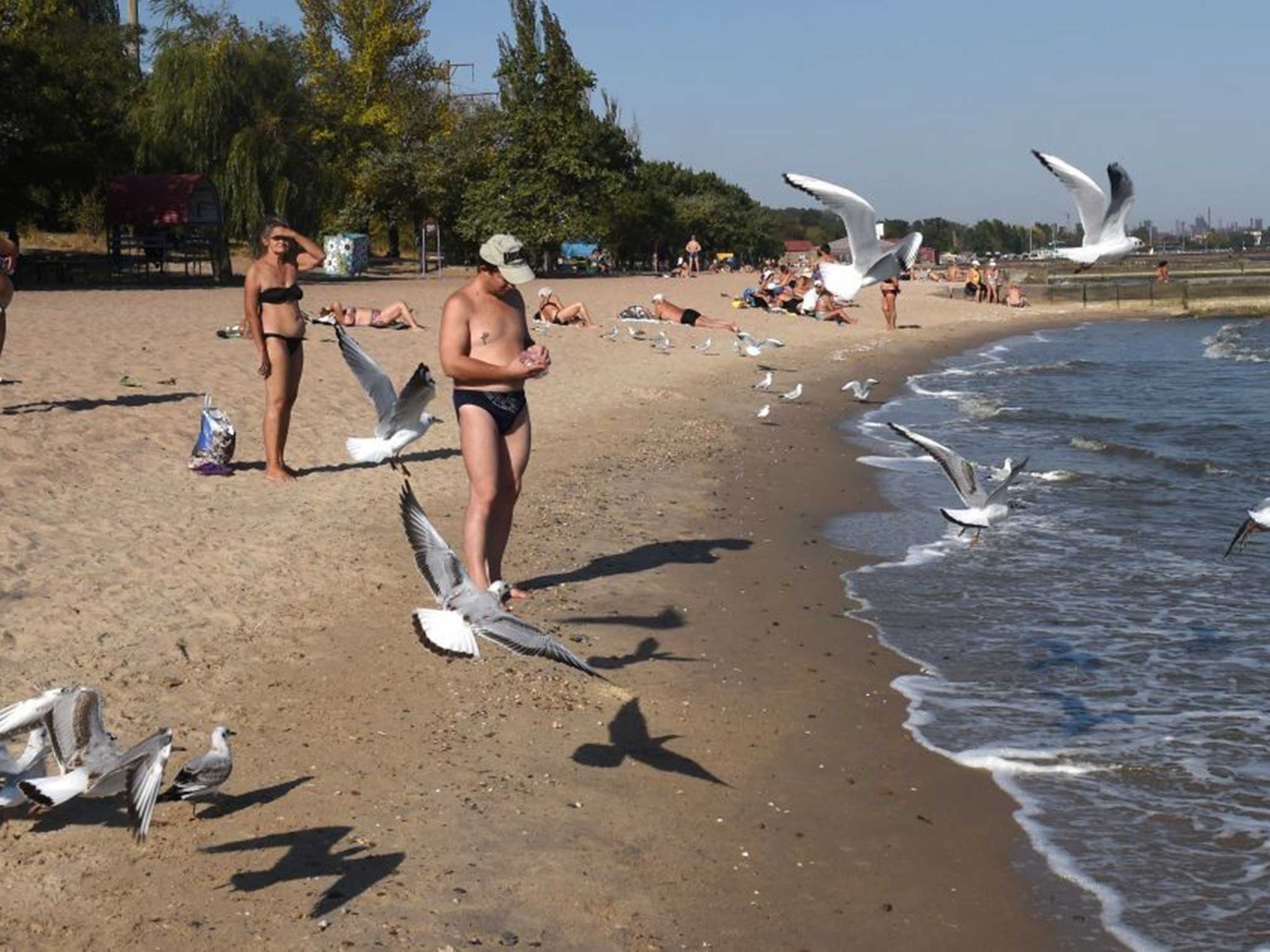 Sunbathers at the beach in Mariupol