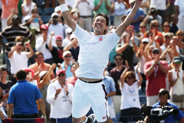 Kei Nishikori, of Japan, reacts after defeating Novak Djokovic