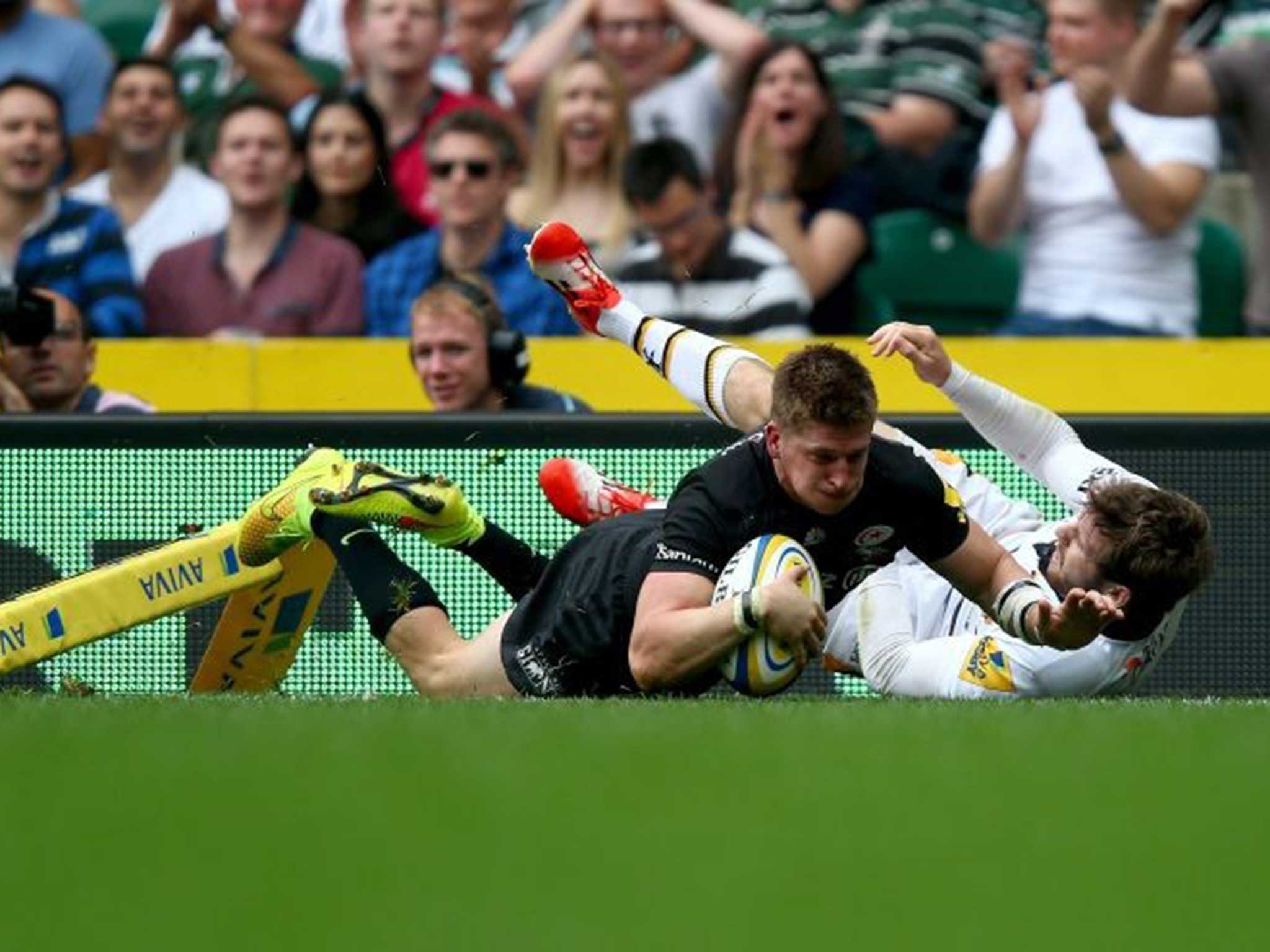 Touchdown: Hat-trick man David Strettle, of Saracens, dives over to claim his second try against Wasps at Twickenham