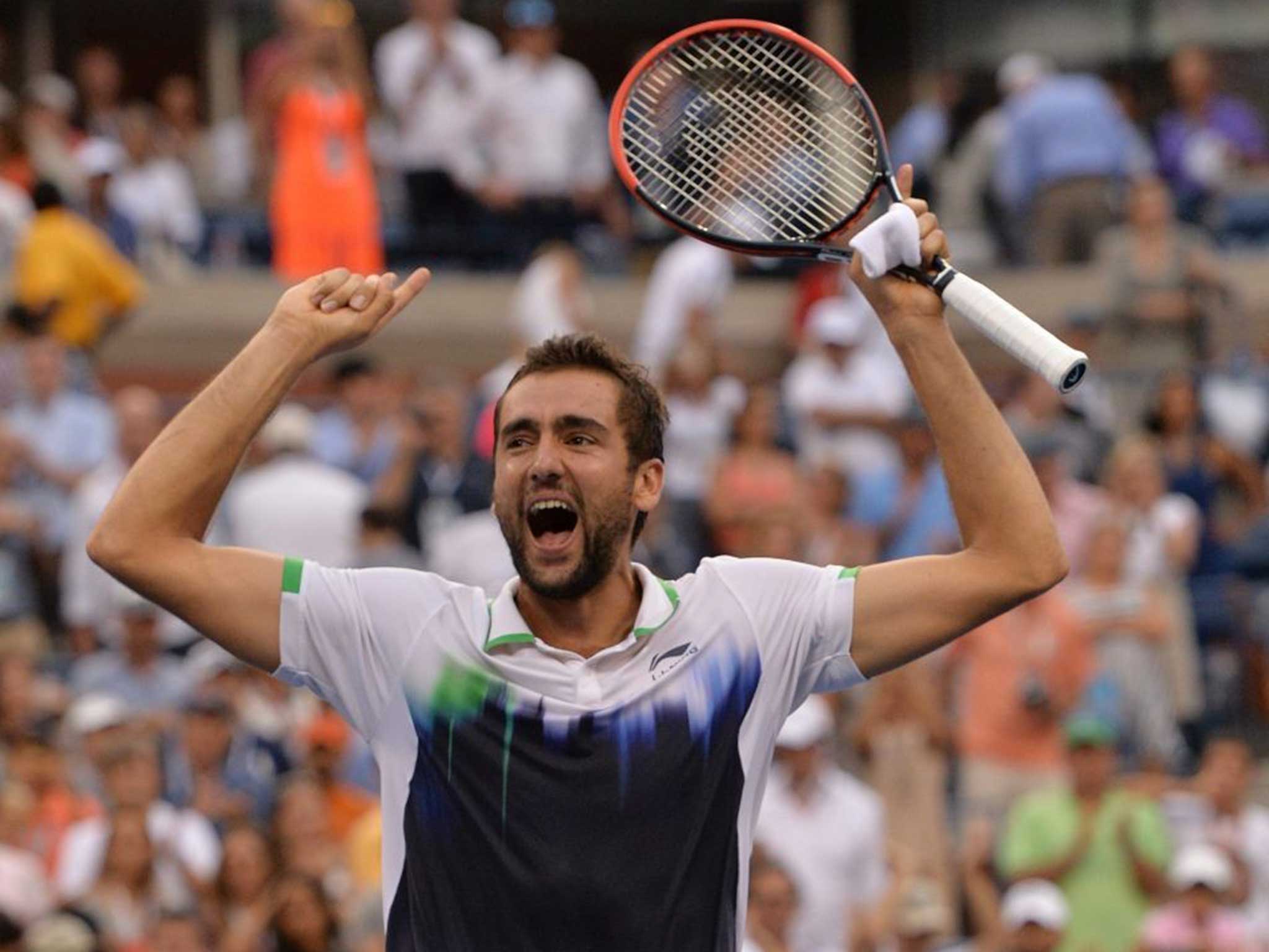 Marin Cilic celebrates after beating Federer