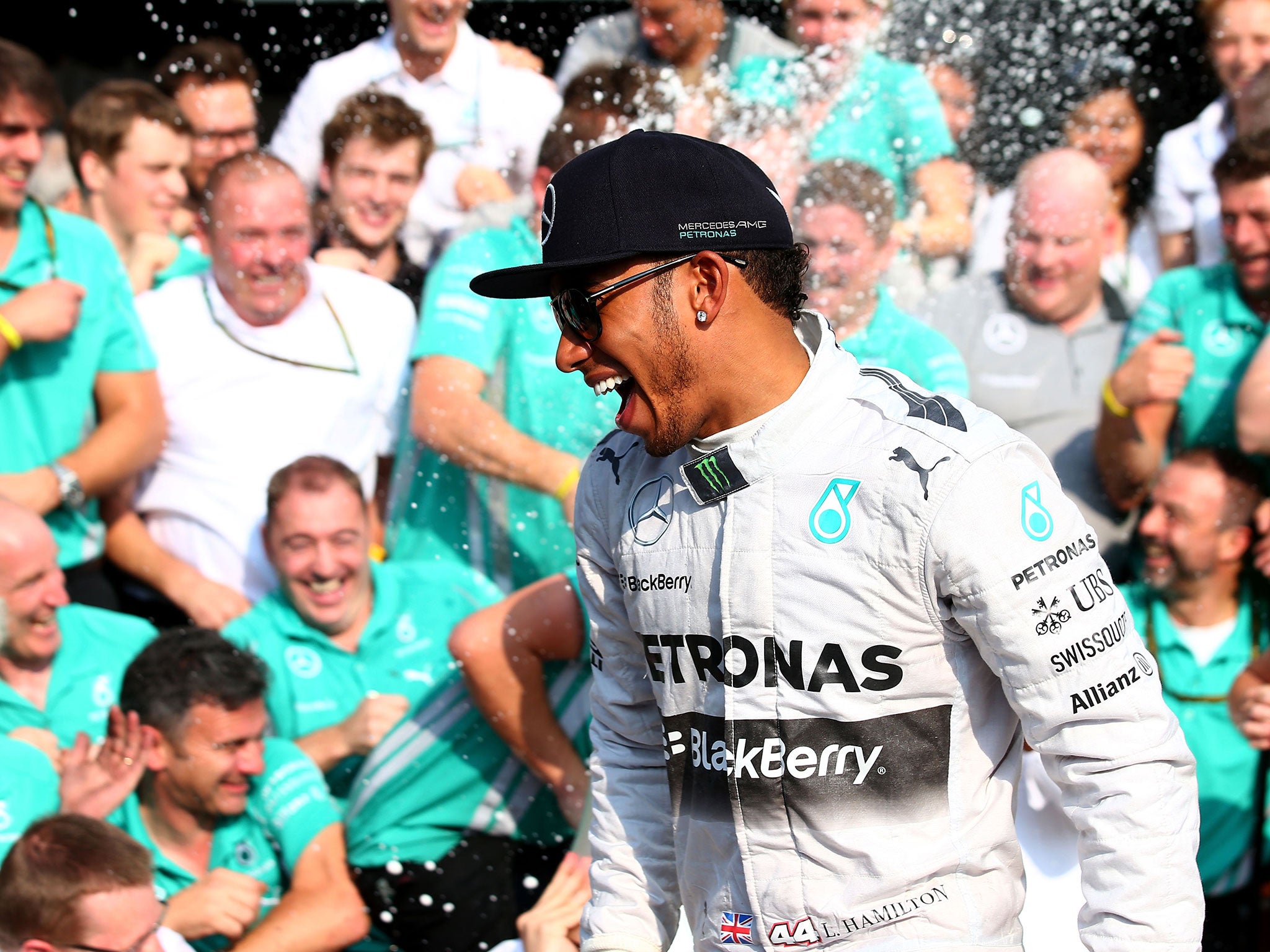 Hamilton celebrates his victory with the Mercedes team