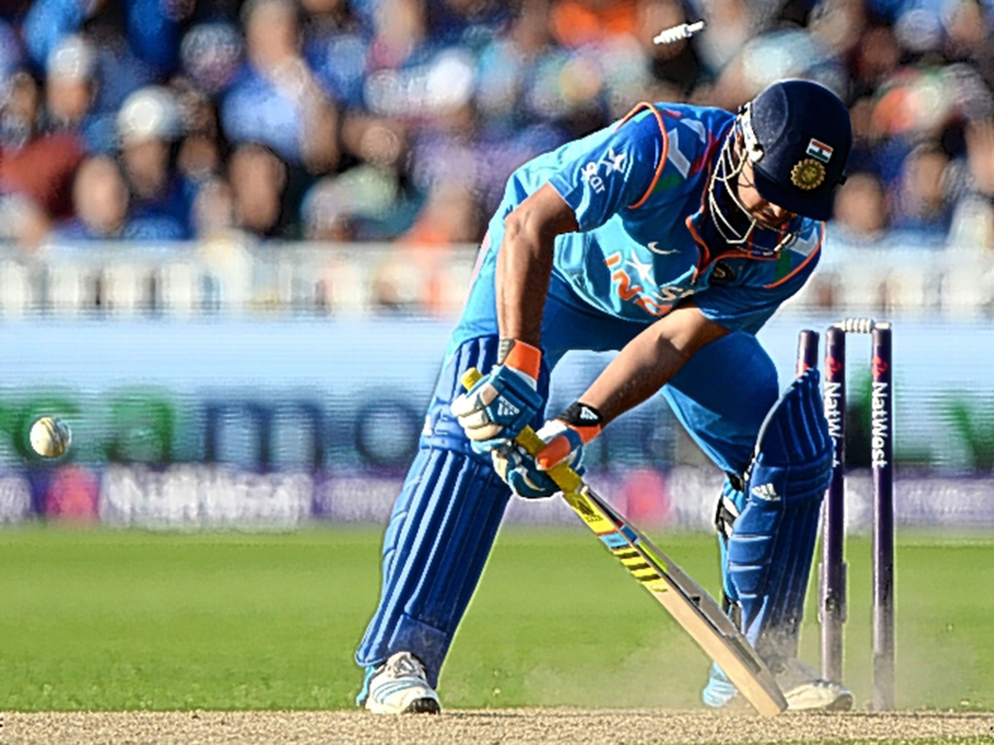 Suresh Raina is bowled by Harry Gurney