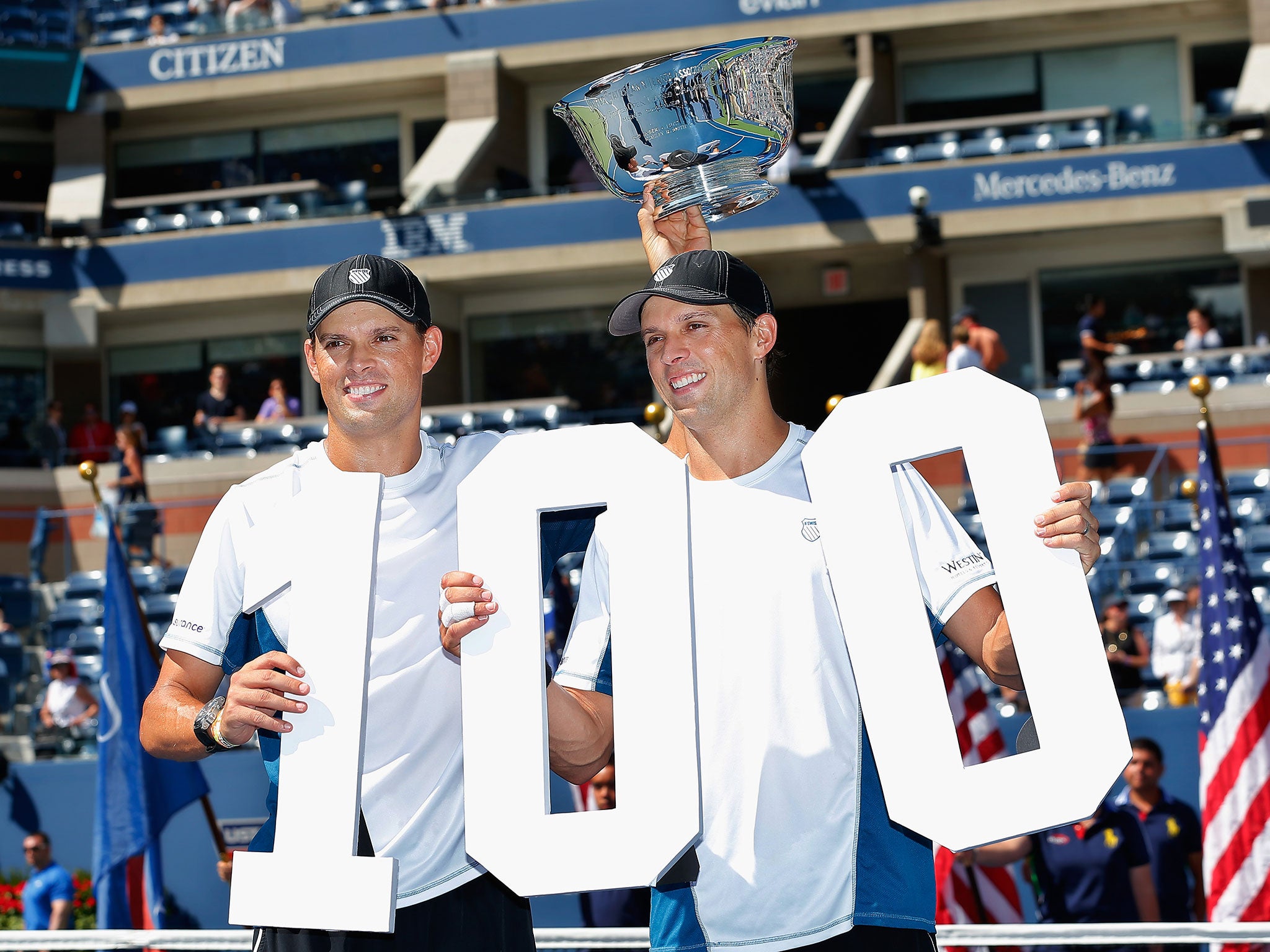 Mike (left) and Bob Bryan celebrate their 100th title