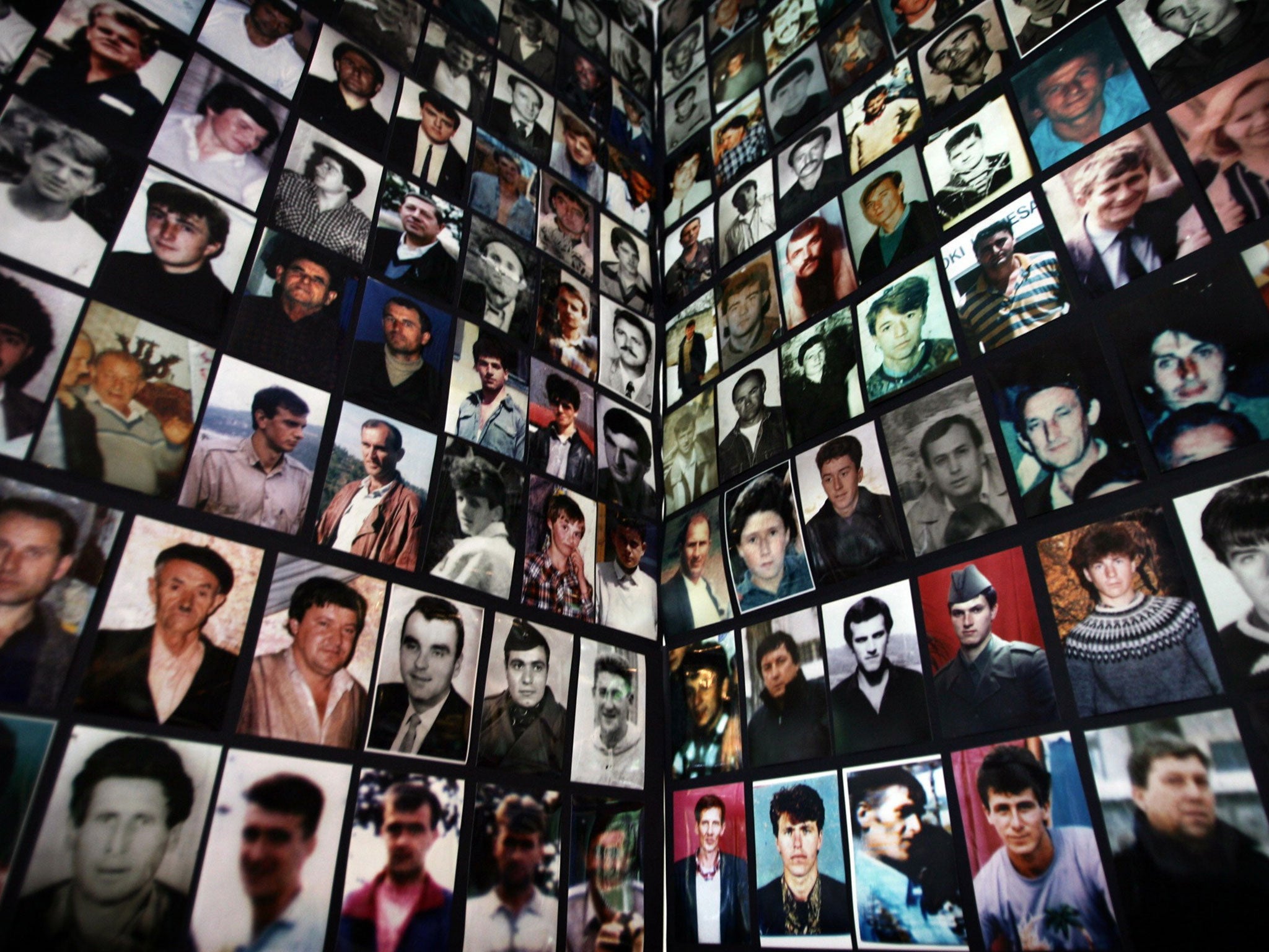 Portraits of victims of the 1995 Srebrenica massacre collected for a memorial in the Bosnian town of Tuzla