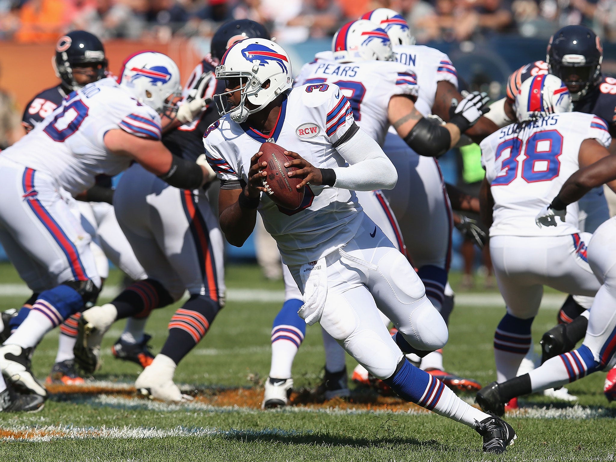 Bills quarter-back EJ Manuel rolls out of the pocket in search of a receiver