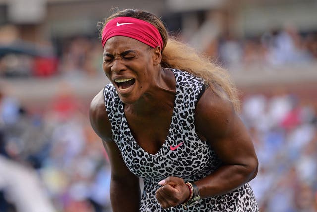Serena Williams of the US reacts to a point against Caroline Wozniacki of Denmark during their US Open 2014 women's singles finals match at the USTA Billie Jean King National Center in New York 