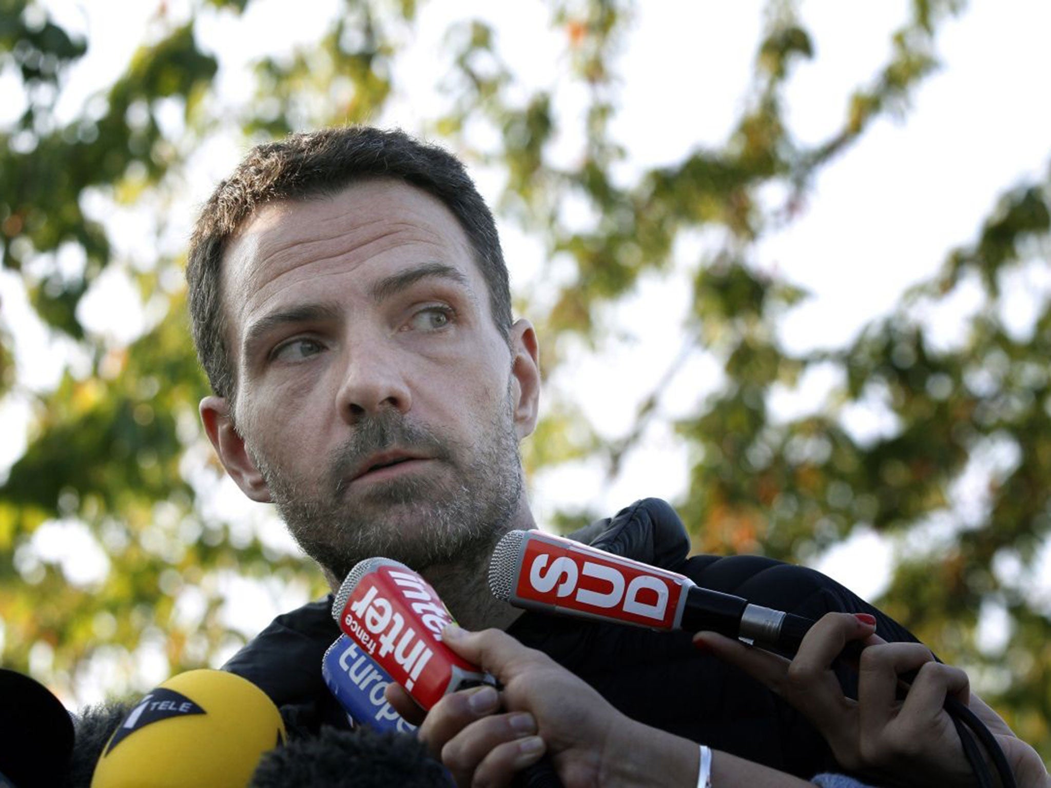 Jerome Kerviel speaks to reporters as he leaves the France's Fleury-Merogis prison, south of Paris