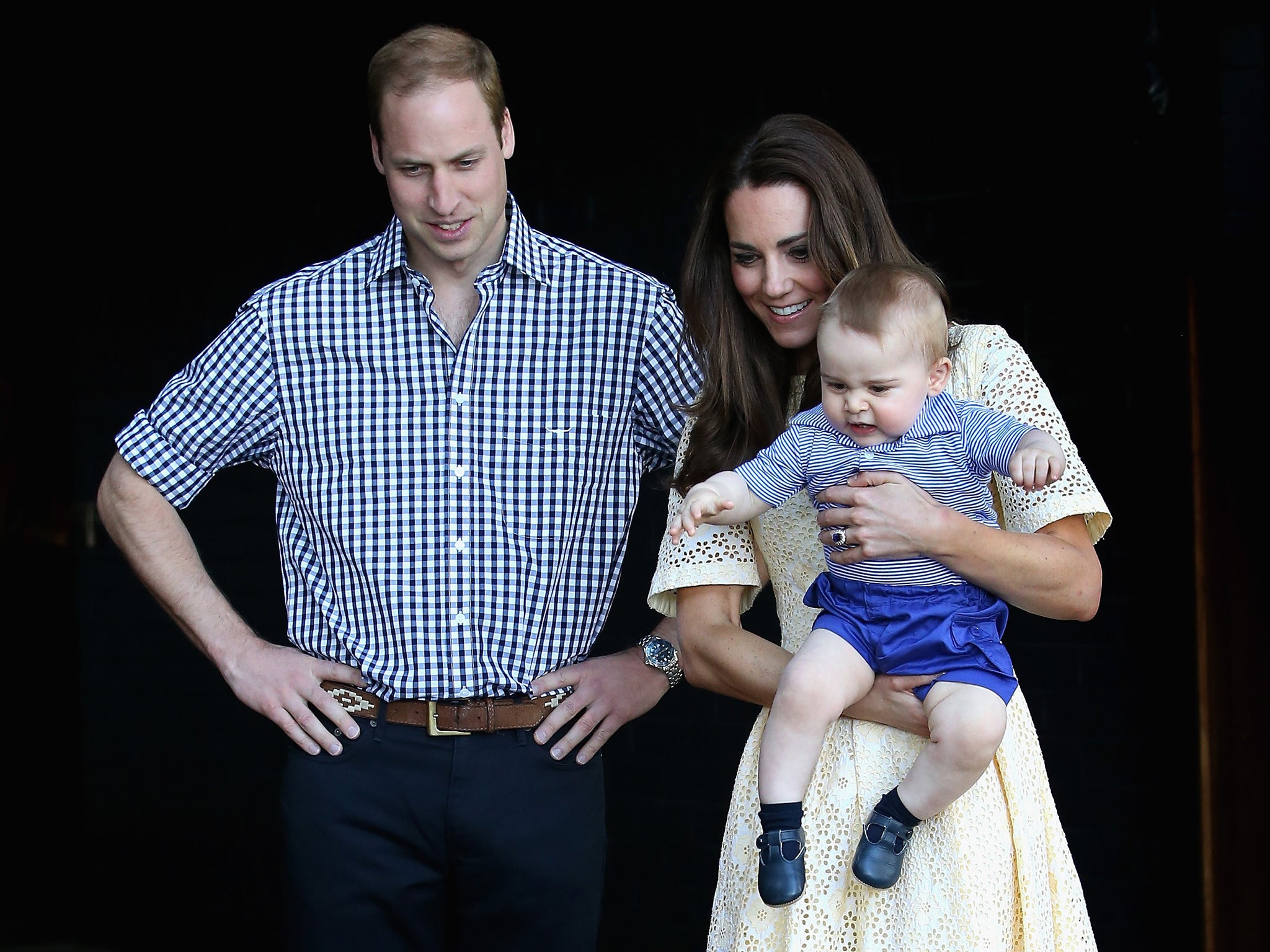 Catherine, Duchess of Cambridge holds Prince George of Cambridge as Prince William, Duke of Cambridge looks on whilst meeting a Bilby called George at Taronga Zoo in Sydney
