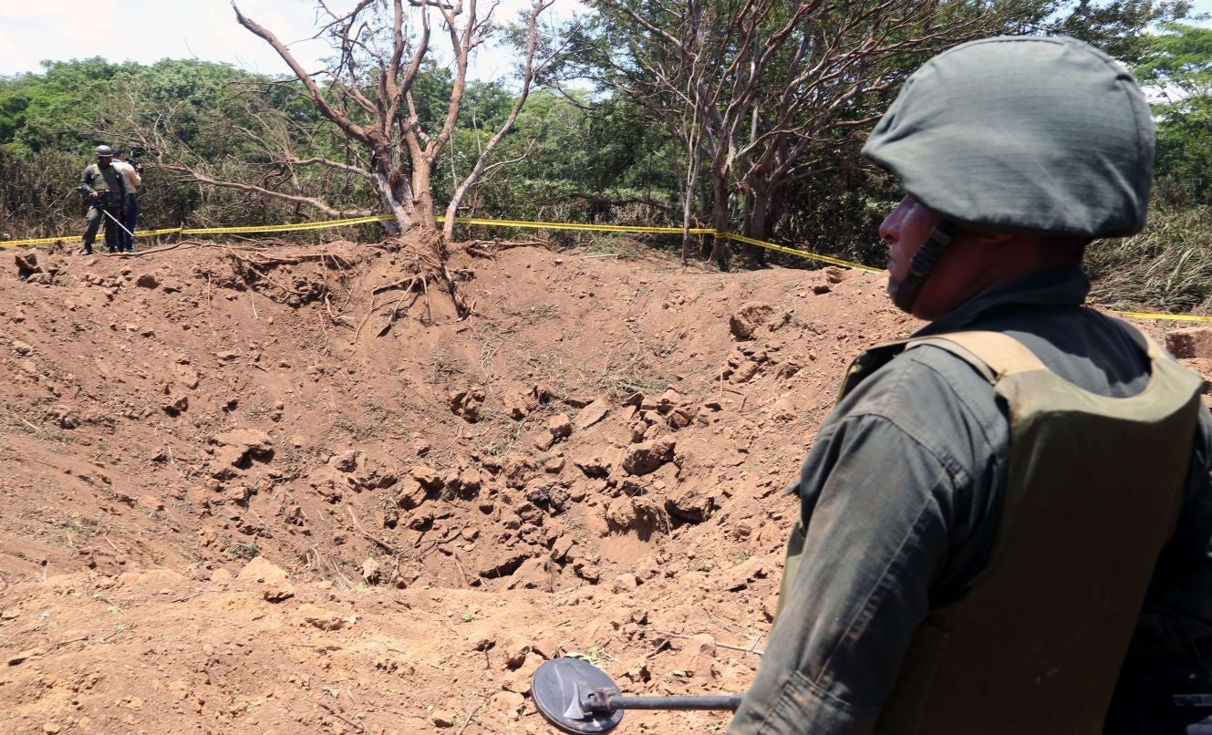 A Nicaraguan soldier checking the crater