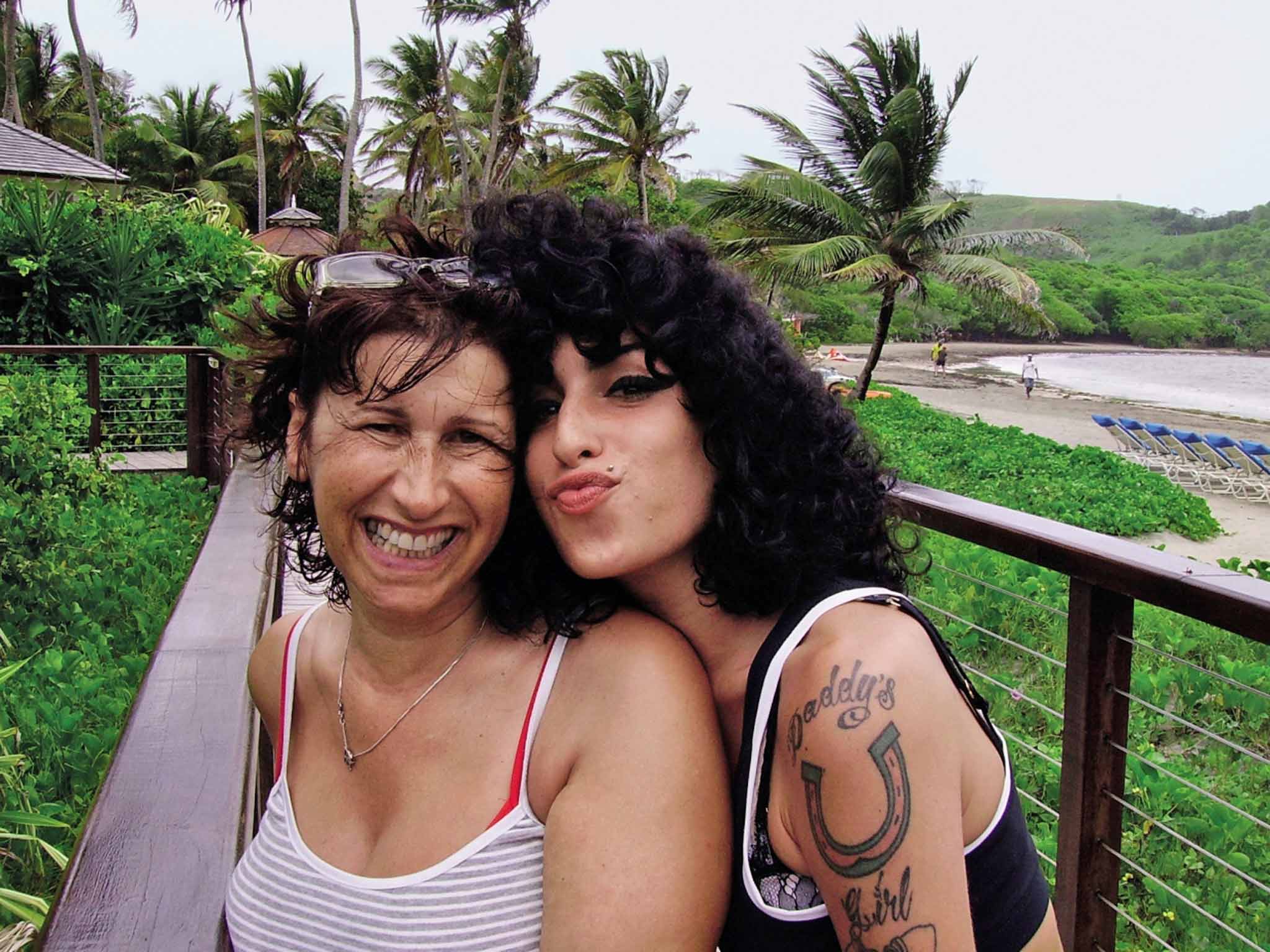 Island in the sun: Janis and her daughter Amy in healthier, happier times in St Lucia in 2009