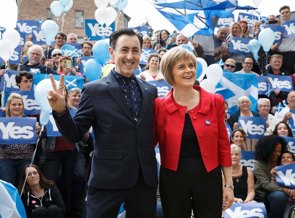 Deputy First Minister of Scotland Nicola Sturgeon and actor Alan Cumming outside the Yes Kelvin campaign hub in Glasgow 