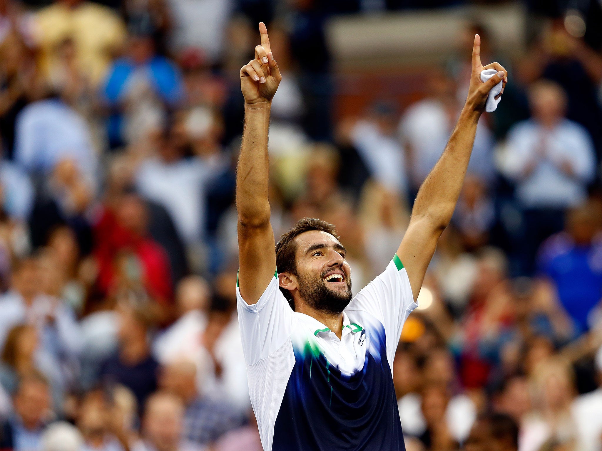 Marin Cilic of Croatia reacts after defeating Kei Nishikori of Japan to win the men's singles final match of the 2014 US Open