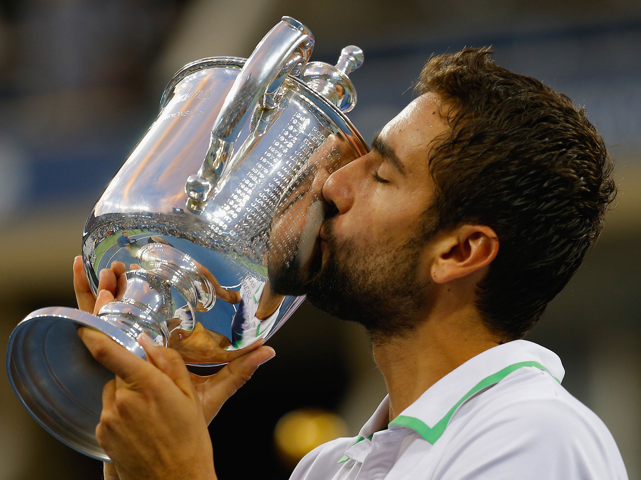 Marin Cilic kisses the US Open trophy after beating Kei Nishikori