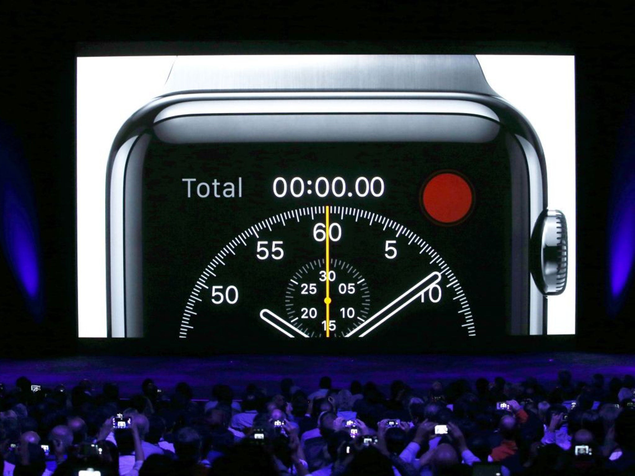 The crowd use their devices to capture the Apple Watch  