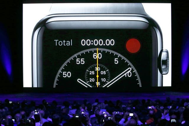 The crowd use their devices to capture the Apple Watch  