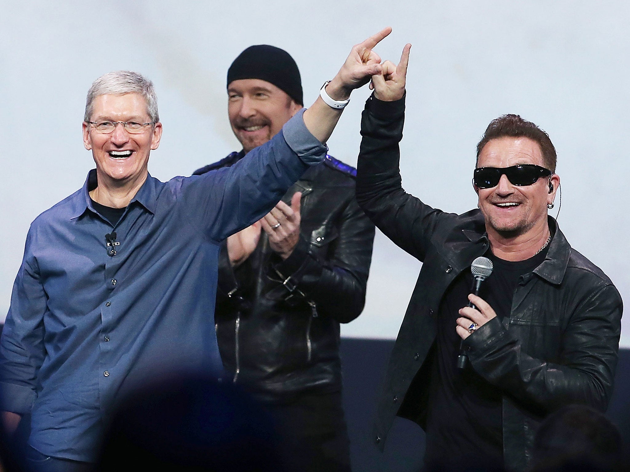 Bono and Apple CEO Tim Cook announce U2's surprise new album at the iPhone 6 launch 