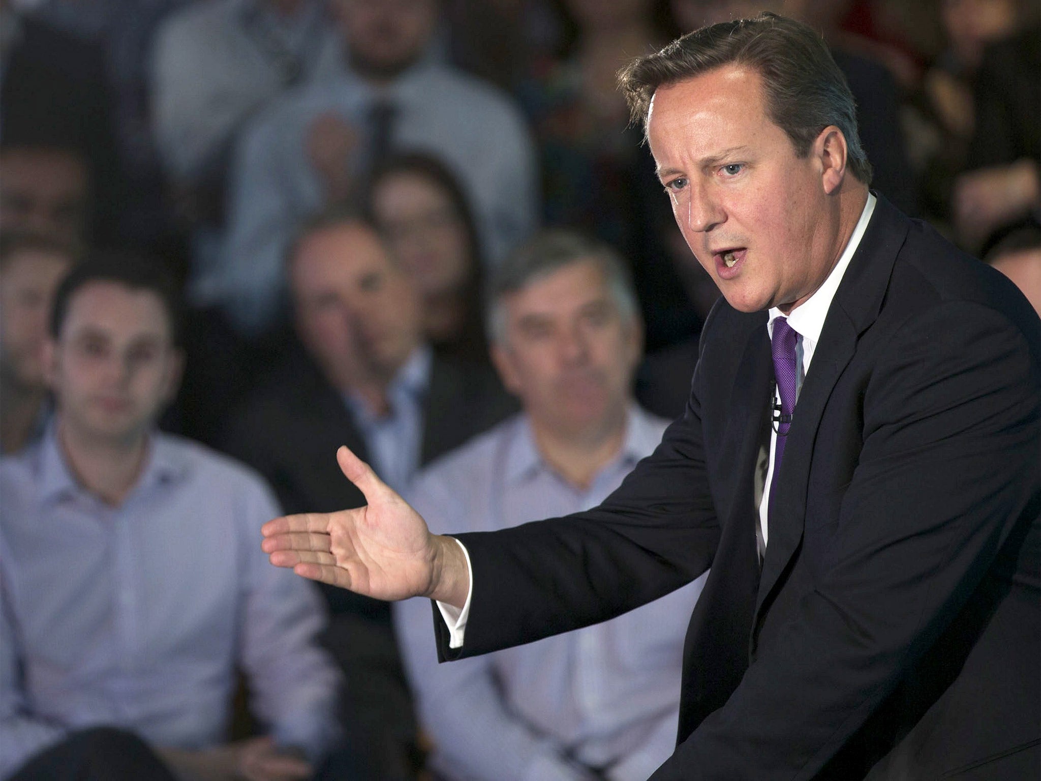 British Prime Minister David Cameron gestures as he speaks during a visit to Scottish Widows offices in Edinburgh