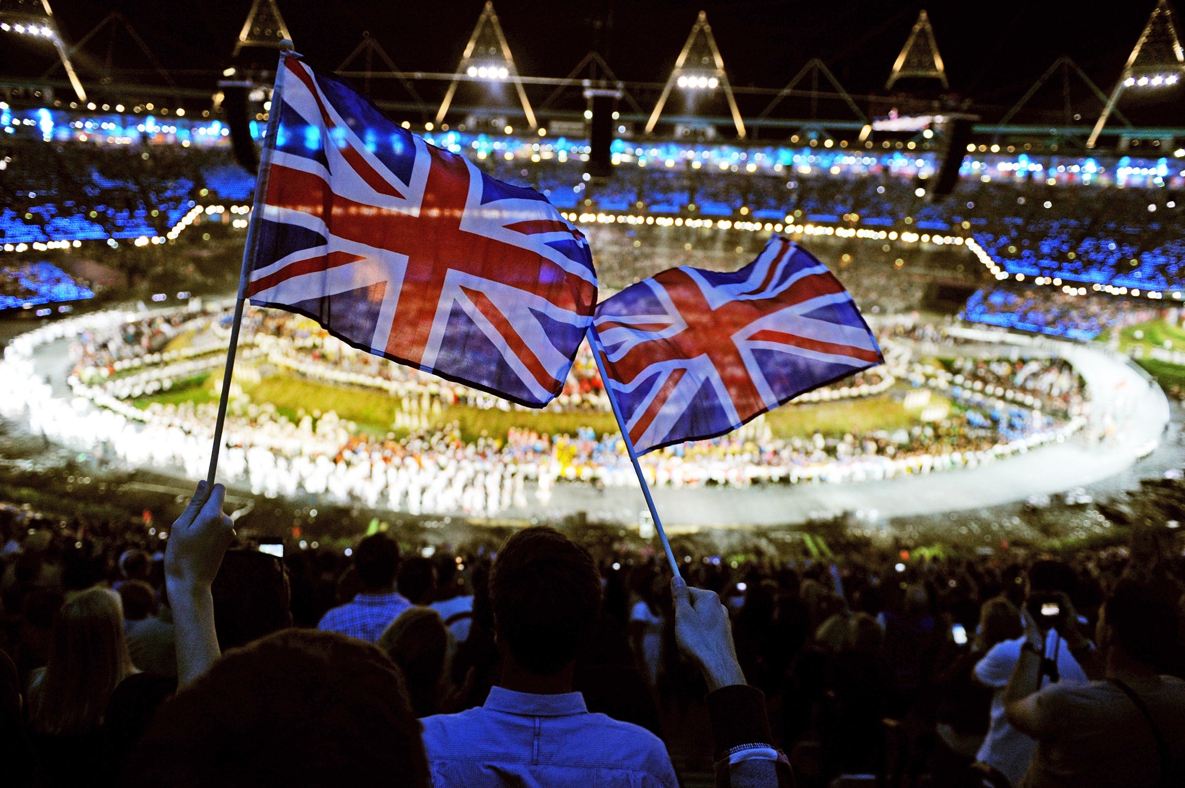 Union Jacks are waved during the Olympic opening ceremony in 2012