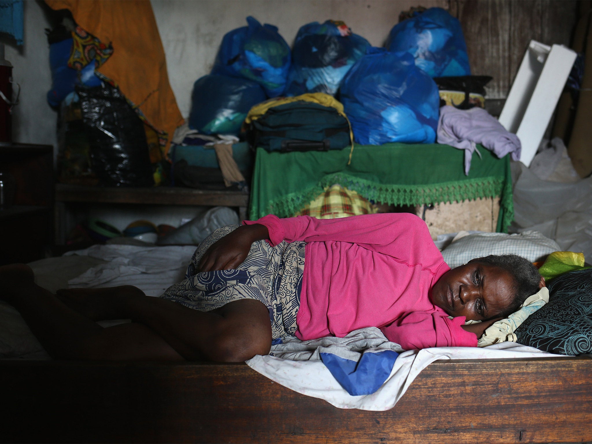 An Ebola patient lies in an isolation ward in Monrovia, Liberia (Getty)