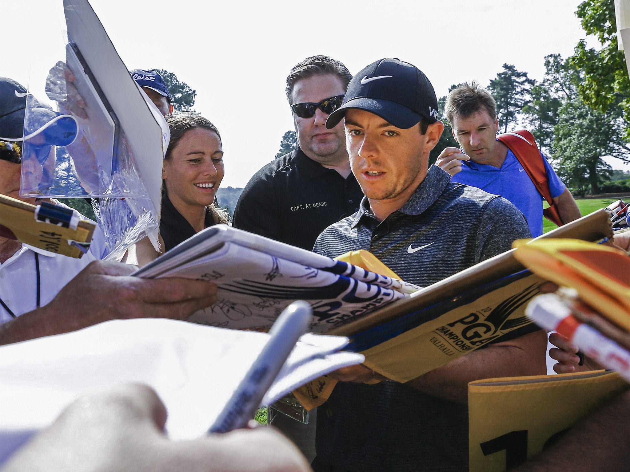 Rory McIlroy takes time out to sign autographs in Atlanta ahead of the FedEx Cup Play-offs