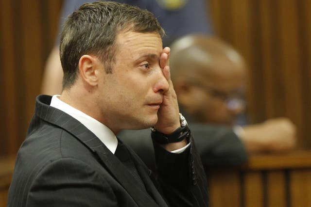 Oscar Pistorius cries in the dock during the verdict in his murder trial in Pretoria