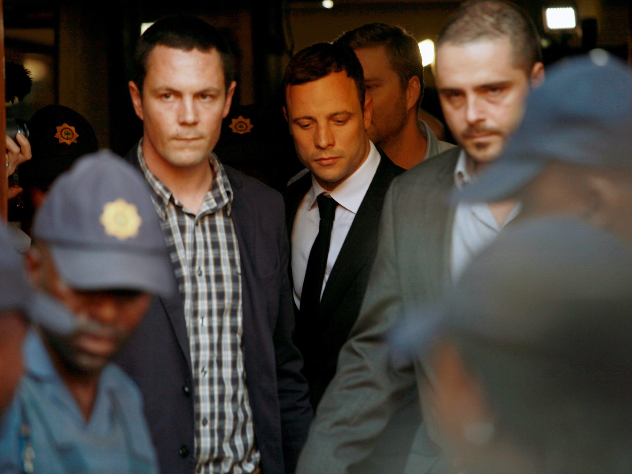 South Africa paralymic athlete Oscar Pistorius leaves court after the first day of the judge's verdict summary