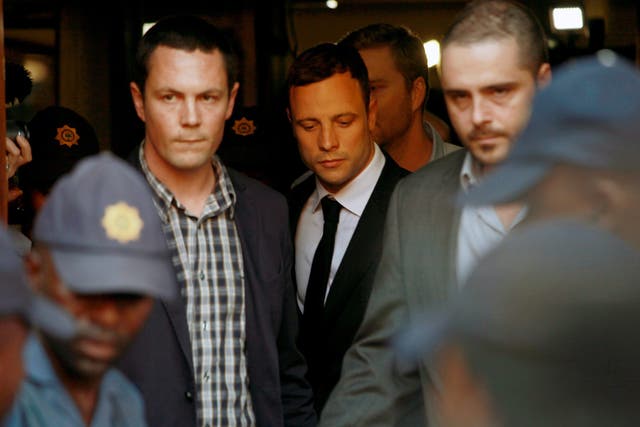 South Africa paralymic athlete Oscar Pistorius leaves court after the first day of the judge's verdict summary 