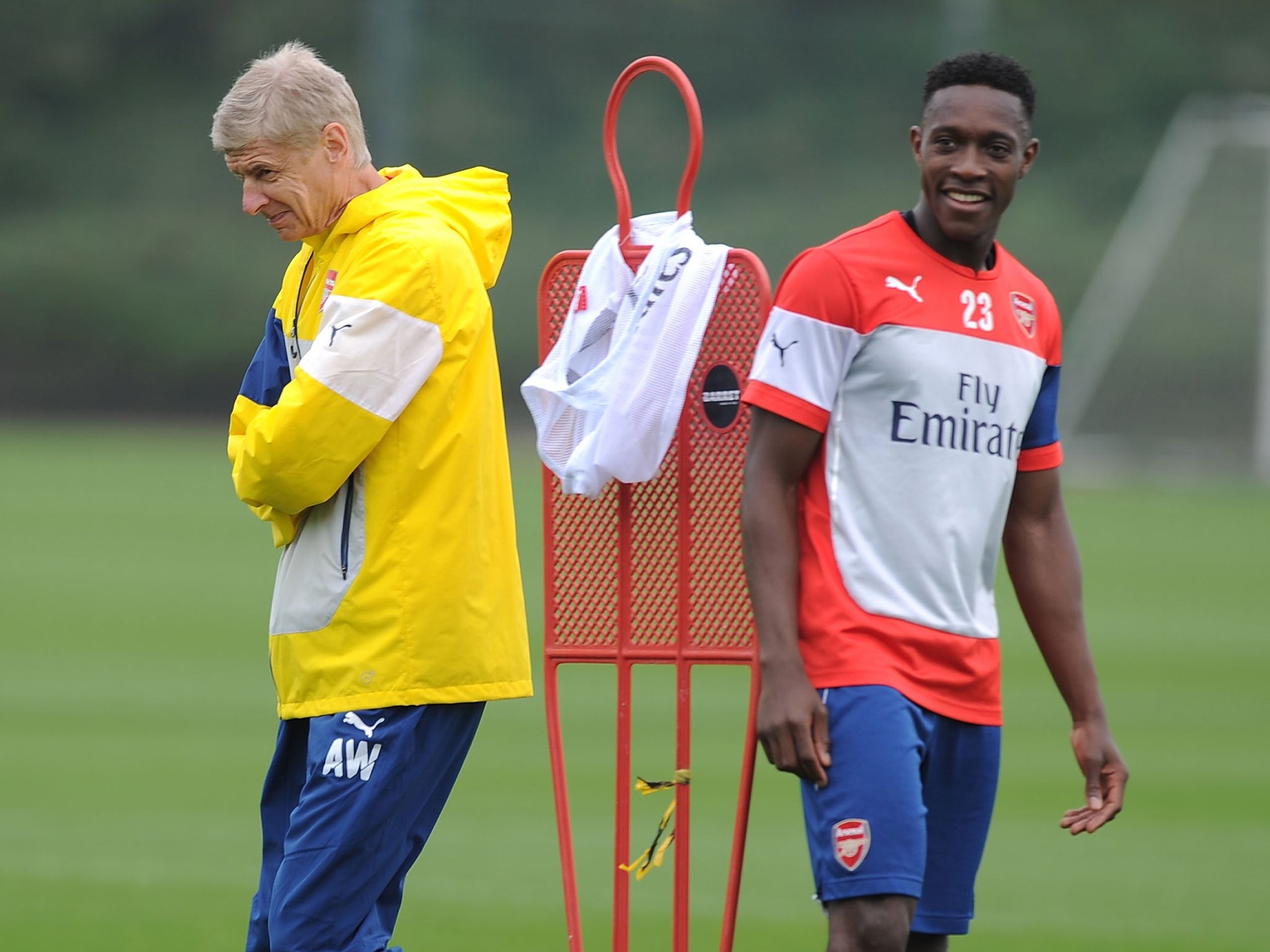 Arsenal manager Arsène Wenger with Danny Welbeck during training at London Colney yesterday