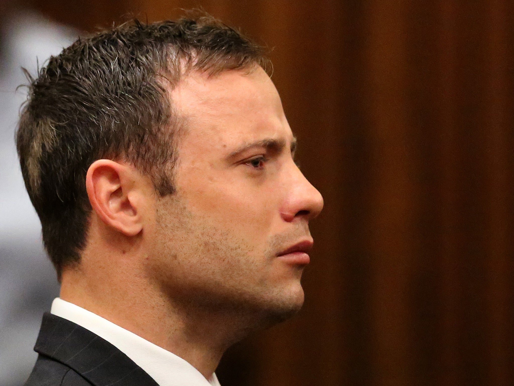 Oscar Pistorius listens to the verdict in his trial at the high court in Pretoria