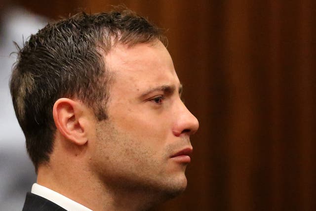 Oscar Pistorius listens to the verdict in his trial at the high court in Pretoria 