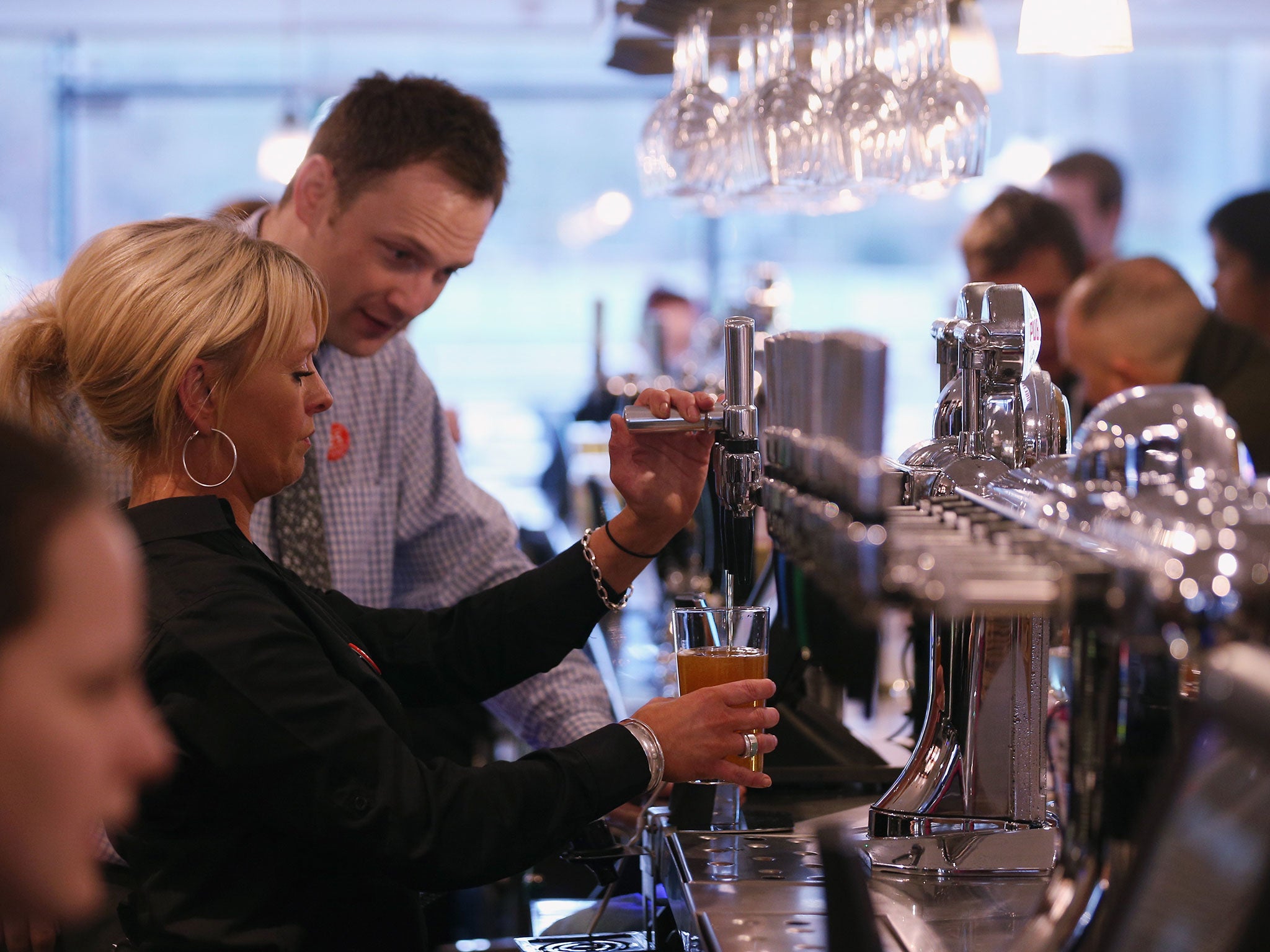 The JD Wetherspoon pub, the 'Hope And Champion', opens for the first day of trading in the Extra Motorway Service Area at junction 2 of the M40 motorway on January 21, 2014 in Beaconsfield, England.