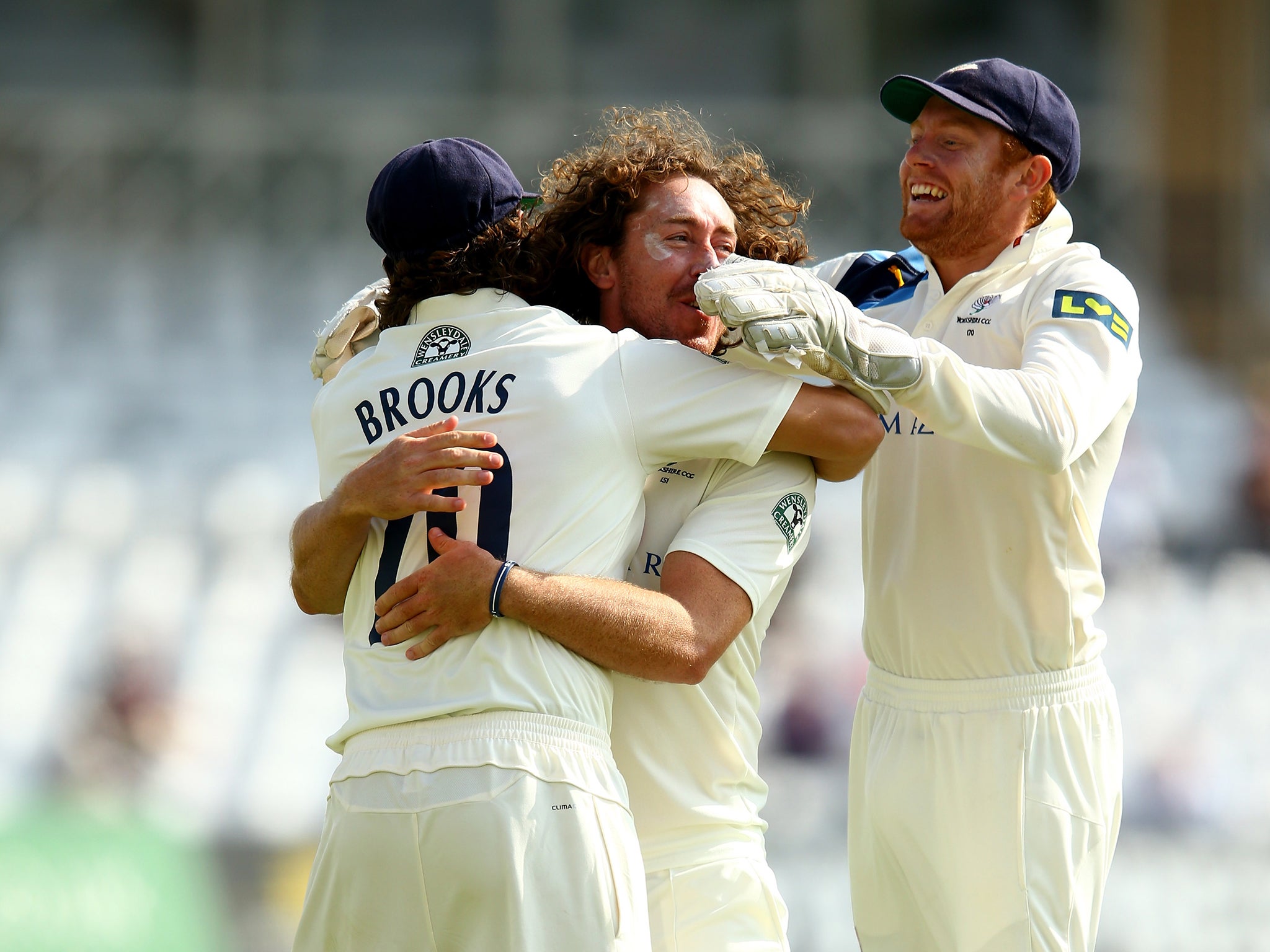 Ryan Sidebottom celebrates with team-mates as Yorkshire clinch the County Championship