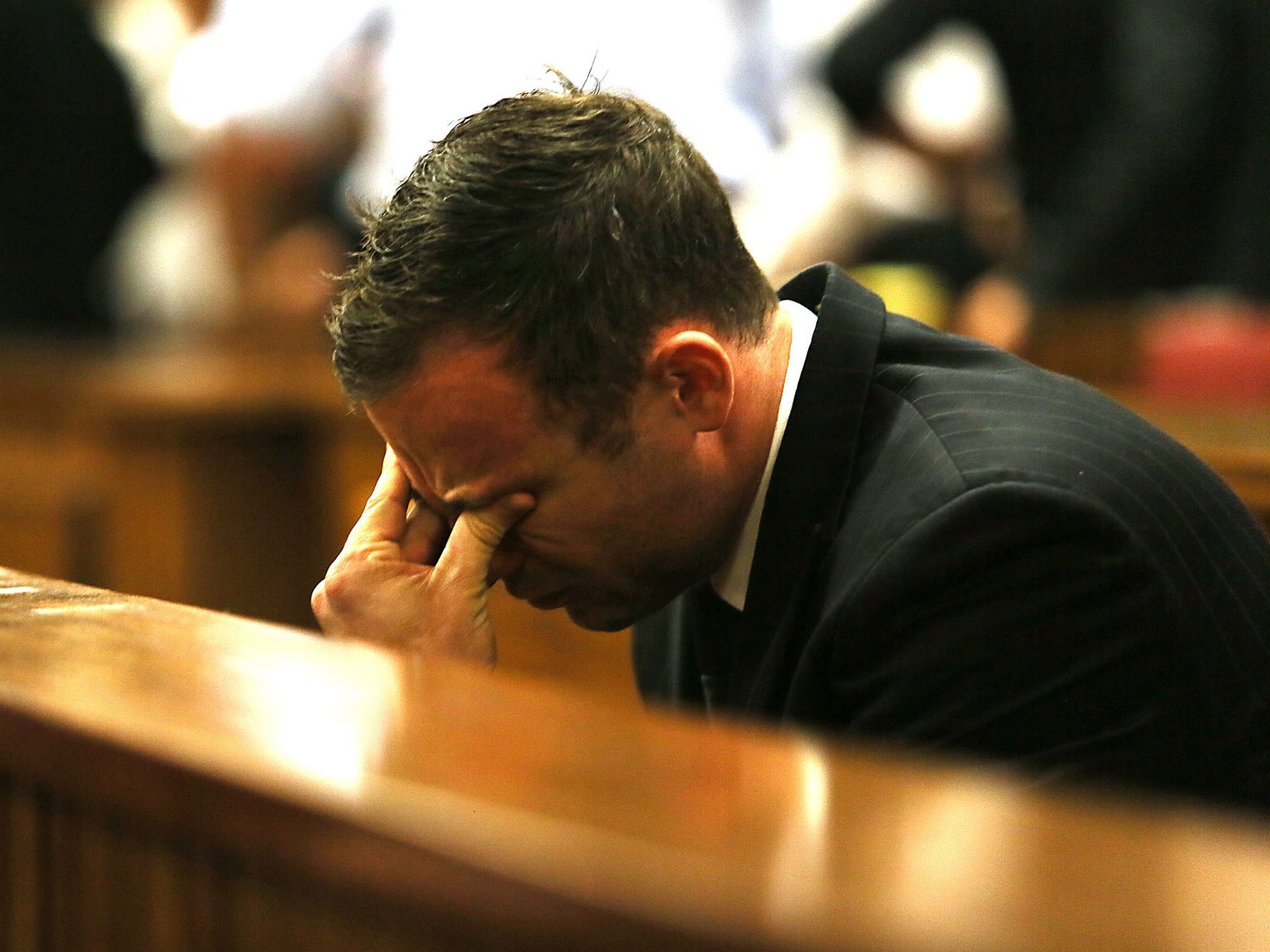 Oscar Pistorius reacts to the verdict in his murder trial at the High Court in Pretoria