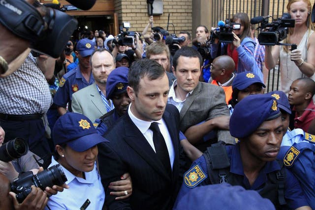 Oscar Pistorius leaving court on bail on 12 September