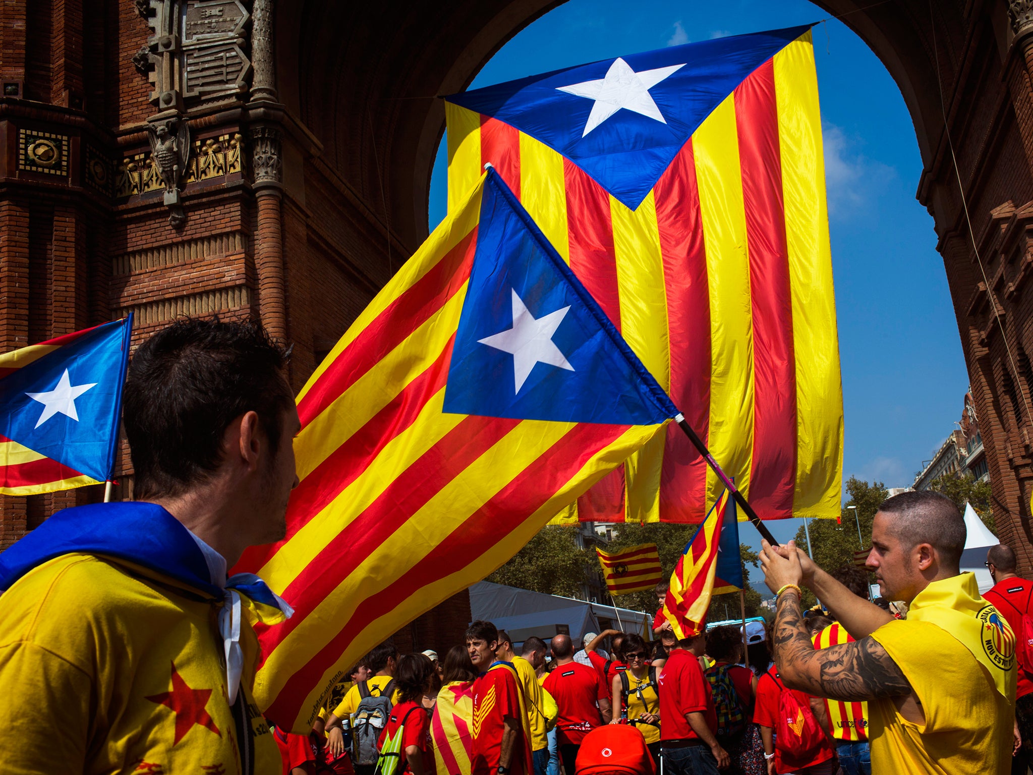 People wave flags, that symbolize Catalonia's independence, in Barcelona