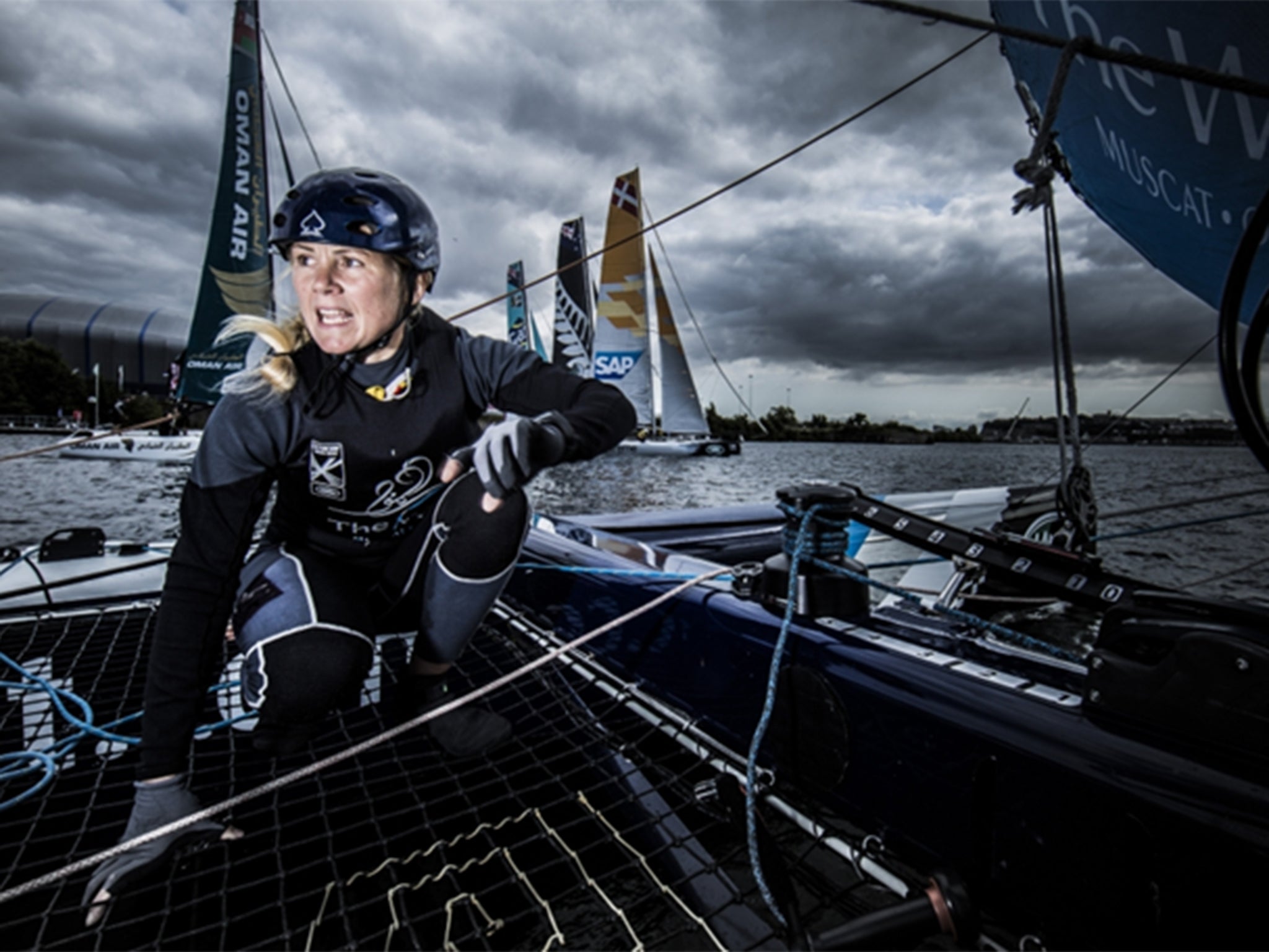 Double gold medallist Sarah Ayton crewed The Wave, Muscat to top spot at the halfway stage of the Extreme Sailing Series regatta in Istanbul
