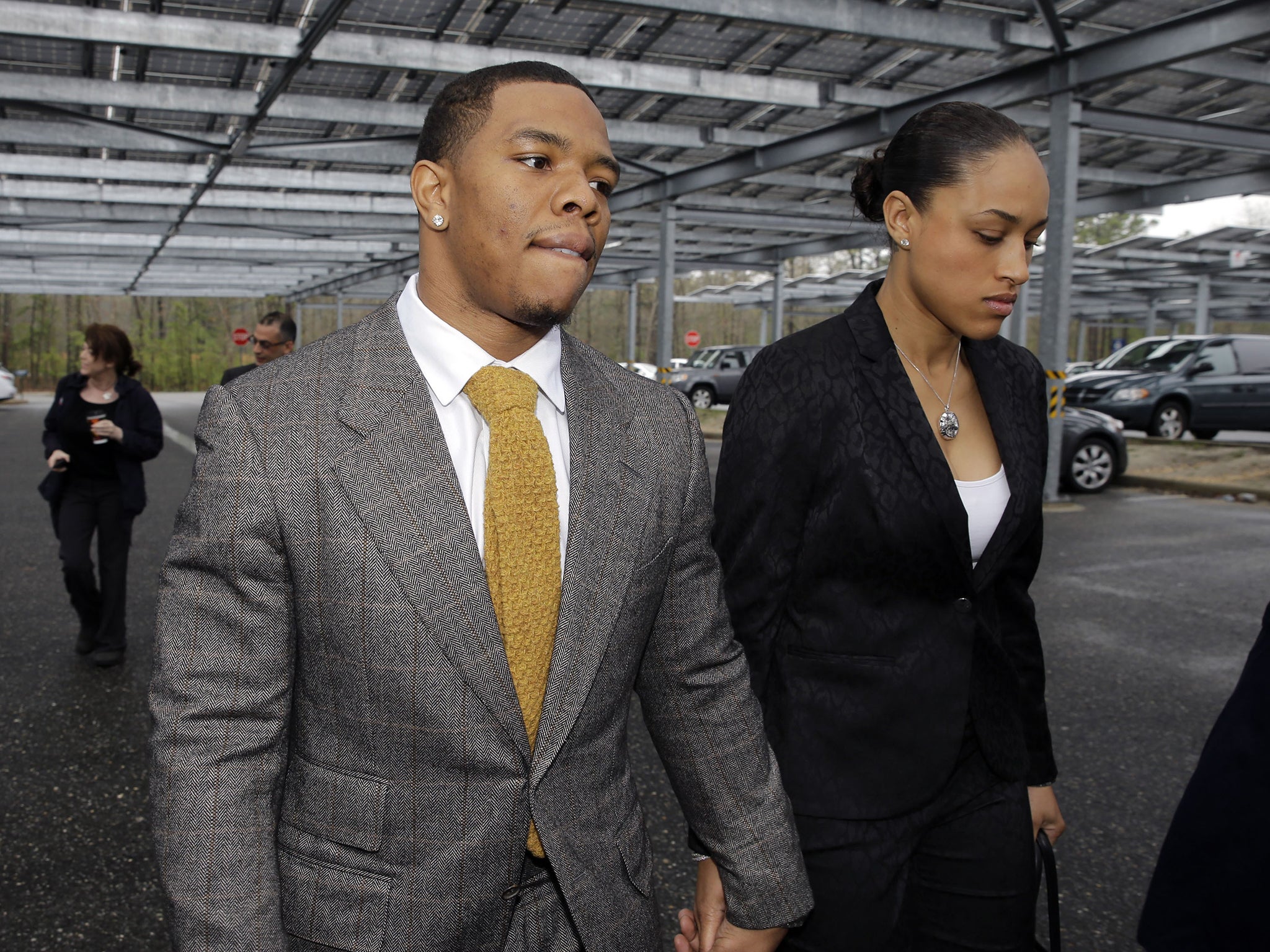 Survivors of domestic violence have felt the need to defend abusive partners like Janay Rice (right)