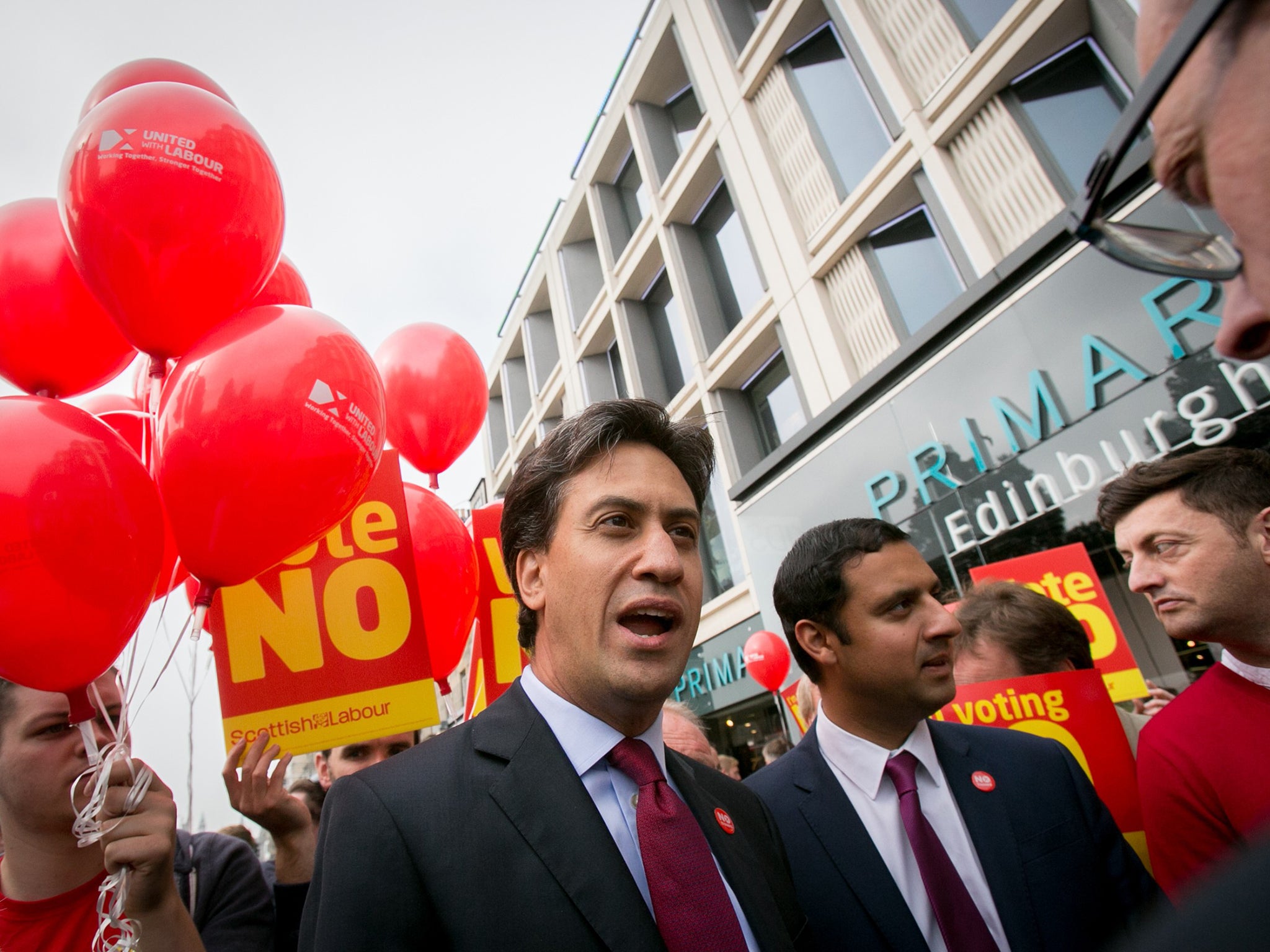 Leader of the Labour Party Ed Miliband speaks with supporters as he visits Edinburgh