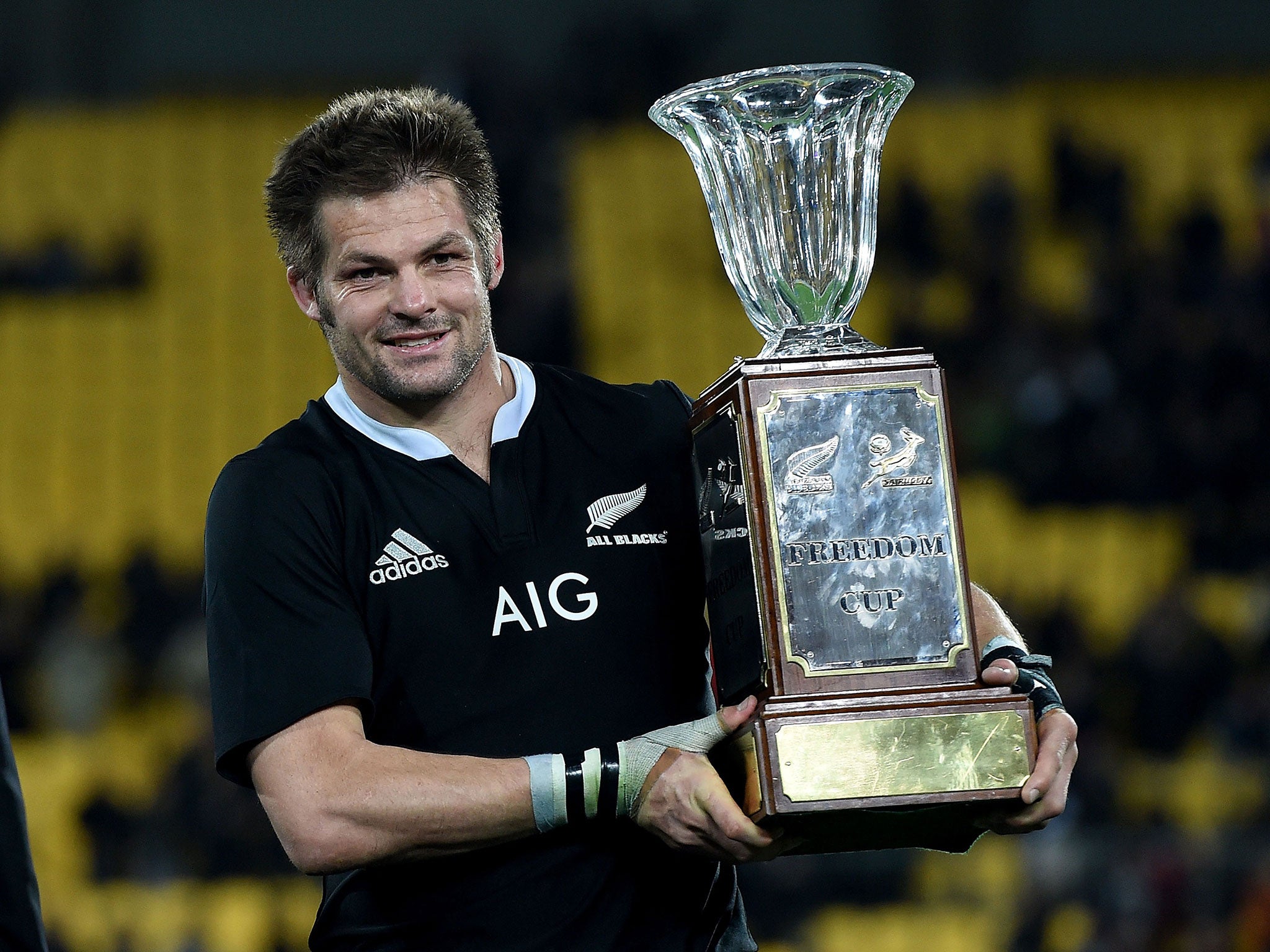 New Zealand's openside flanker captain Richie McCaw holds the Freedom Cup after their win during the Rugby Championship Test between New Zealand and South Africa