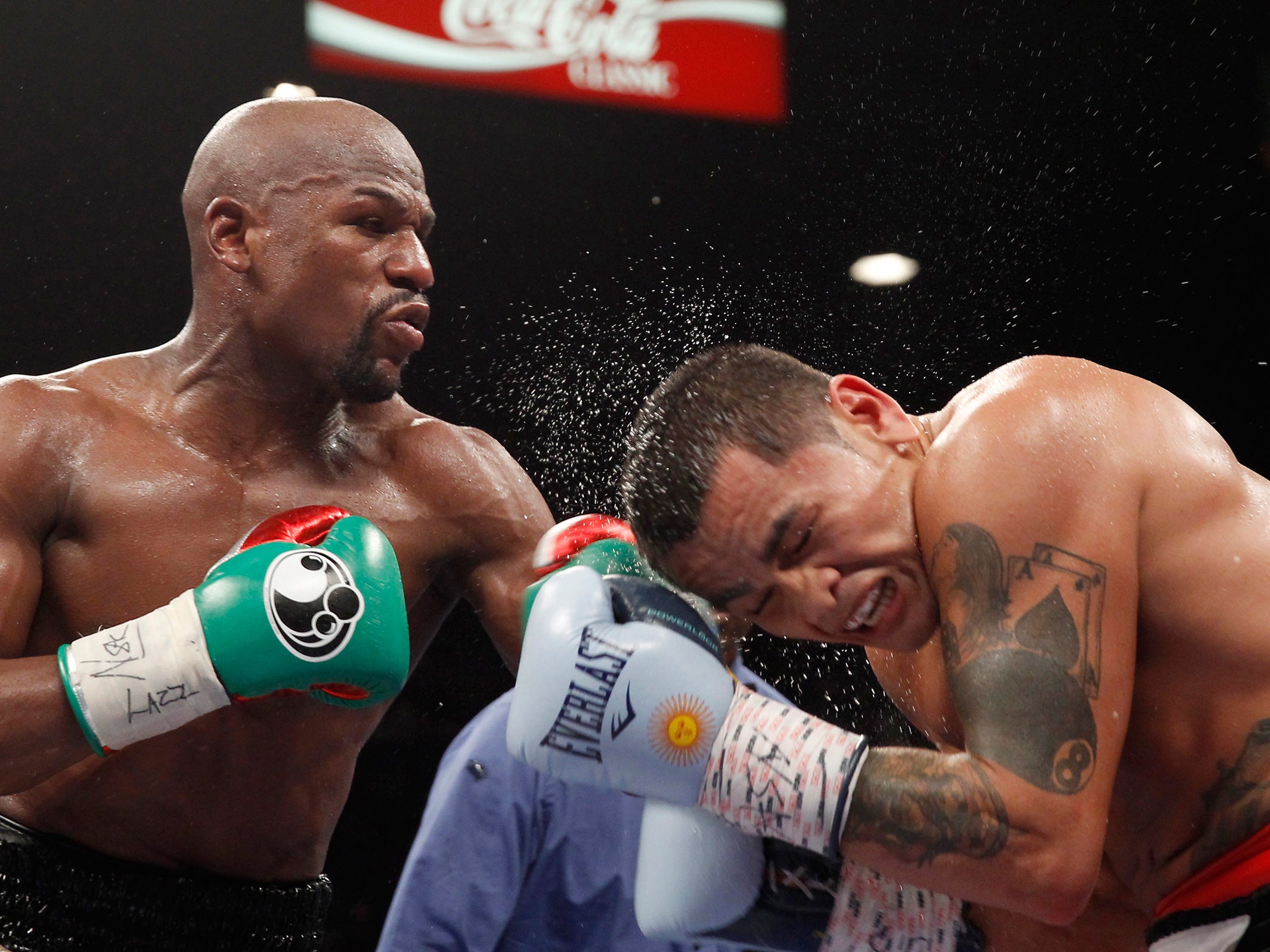 Welterweight champion Floyd Mayweather of the U.S. connects on Marcos Maidana of Argentina during their title fight at the MGM Grand Garden Arena in Las Vegas, Nevada