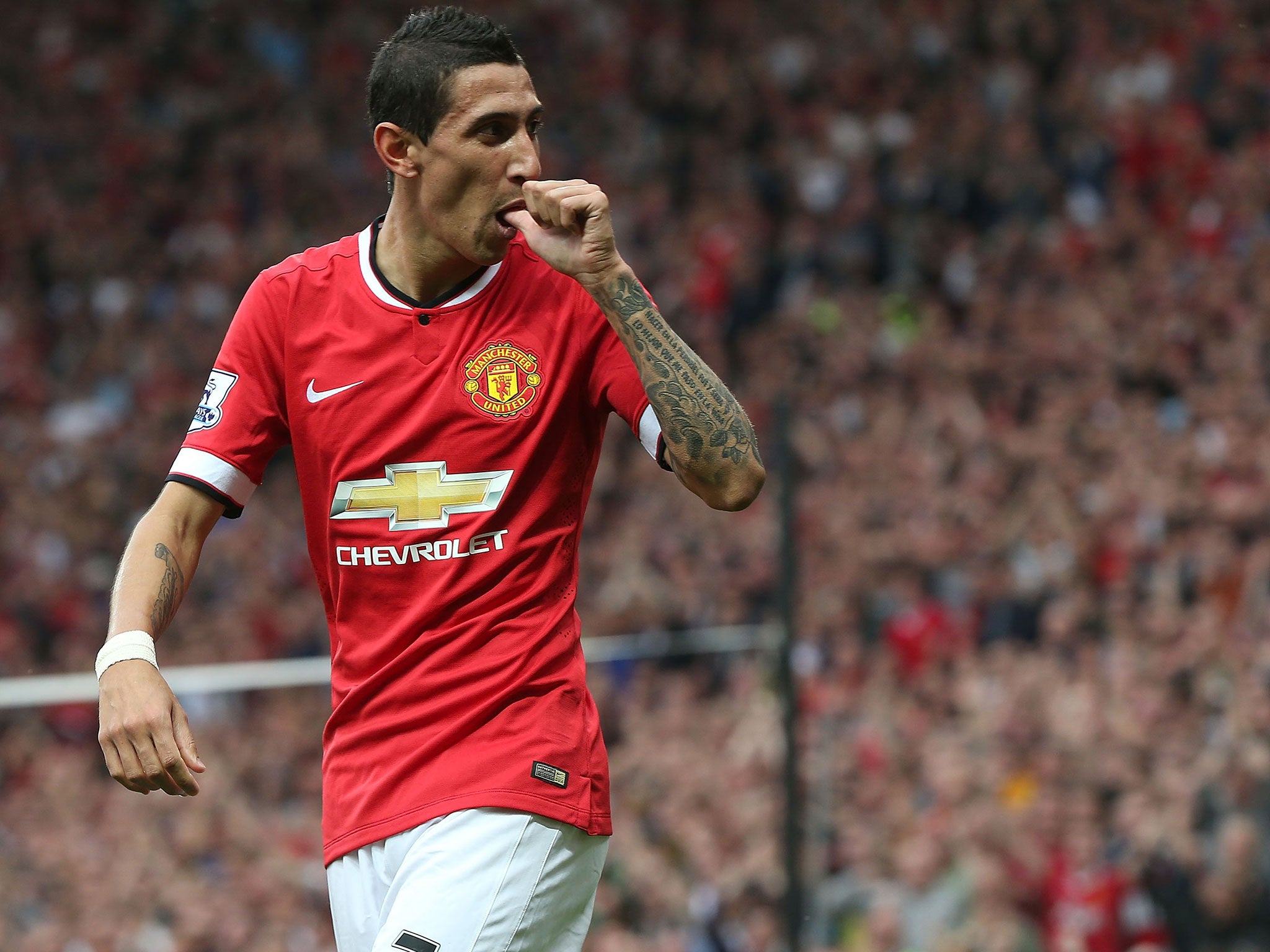 Angel Di Maria celebrates his first goal for Manchester United against QPR
