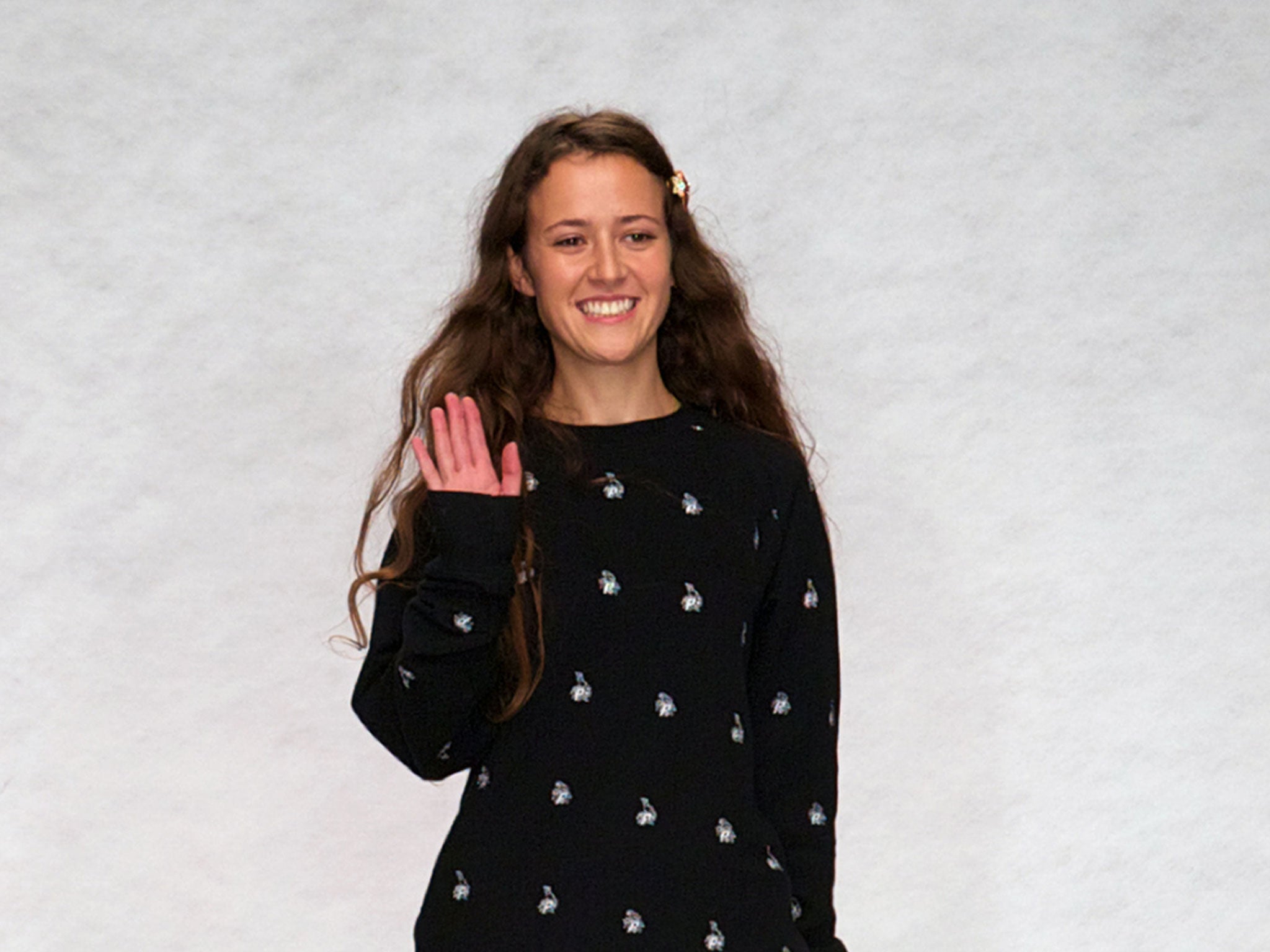 Ashley Williams greets the audience at the end of her 2014 spring/summer runway show during the London Fashion Week in London on 17 September, 2013