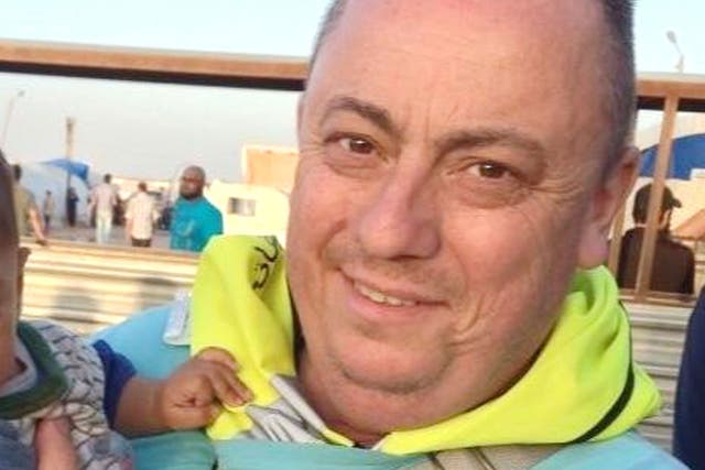 An undated handout photo released by the Foreign Office with the permission of his family, showing Alan Henning at a refugee camp on the Syrian-Turkish border