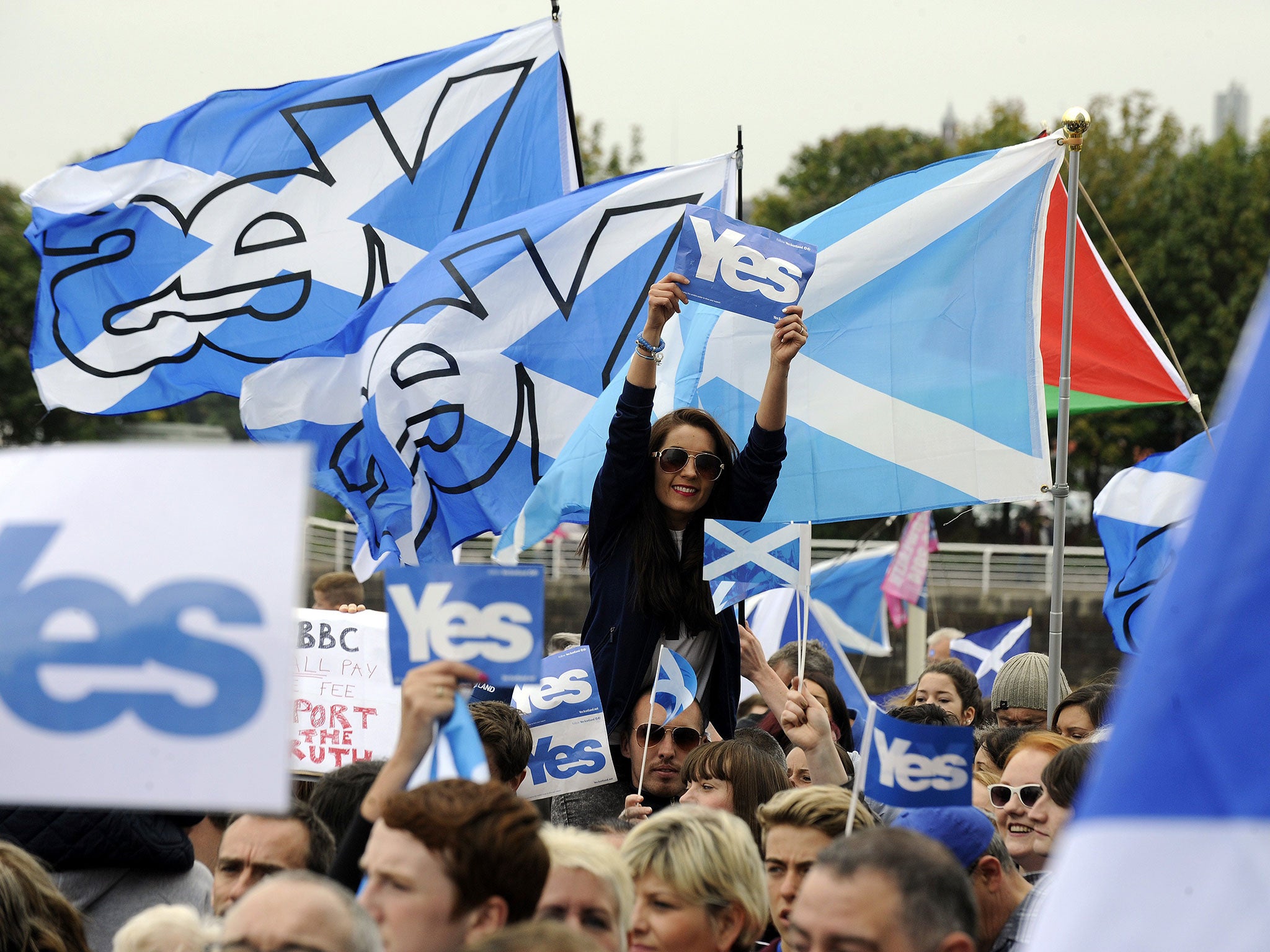 Pro-independence 'Yes' campaigners stage a demonstration outside the BBC Scotland Headquarters in Glasgow on September 14, 2014