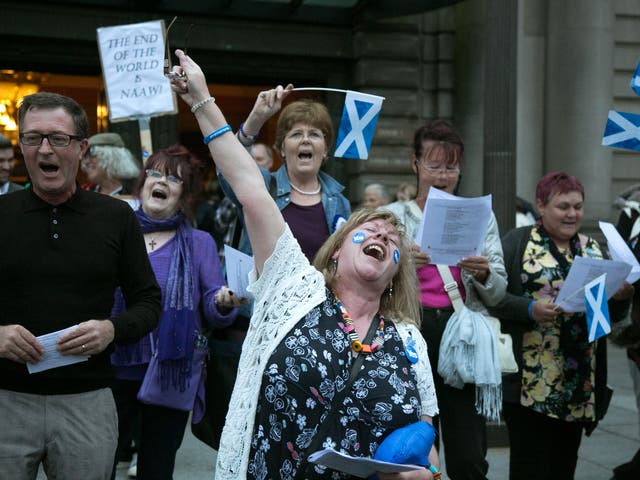 Yes supporters gather outside the Usher Hall, Edinburgh. The latest polls suggest that the 'No' campaign is slightly ahead