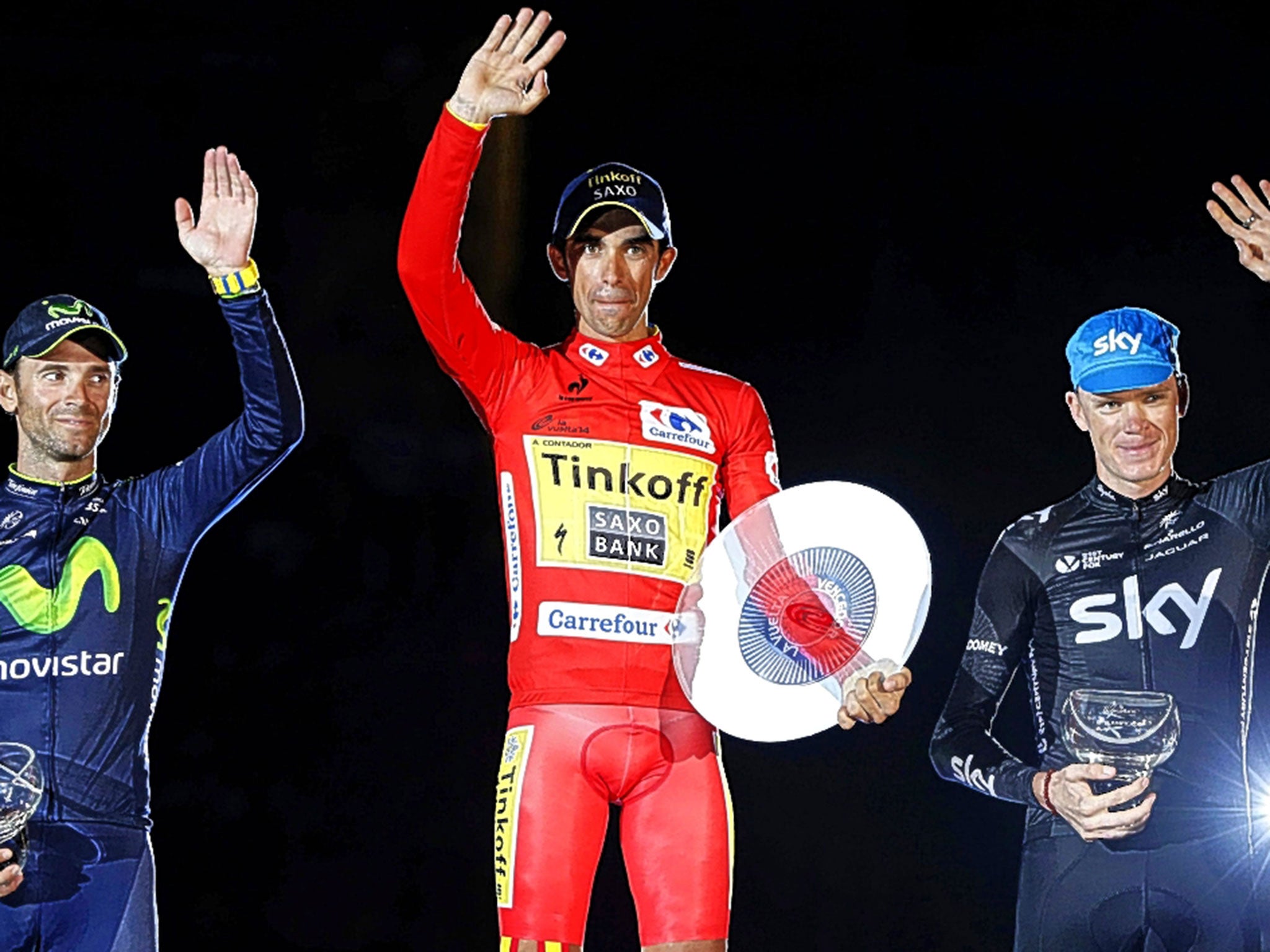 Winner Alberto Contador (centre), Chris Froome (right) and Alejandro Valverde on the podium in Santiago de Compostela on Sunday night