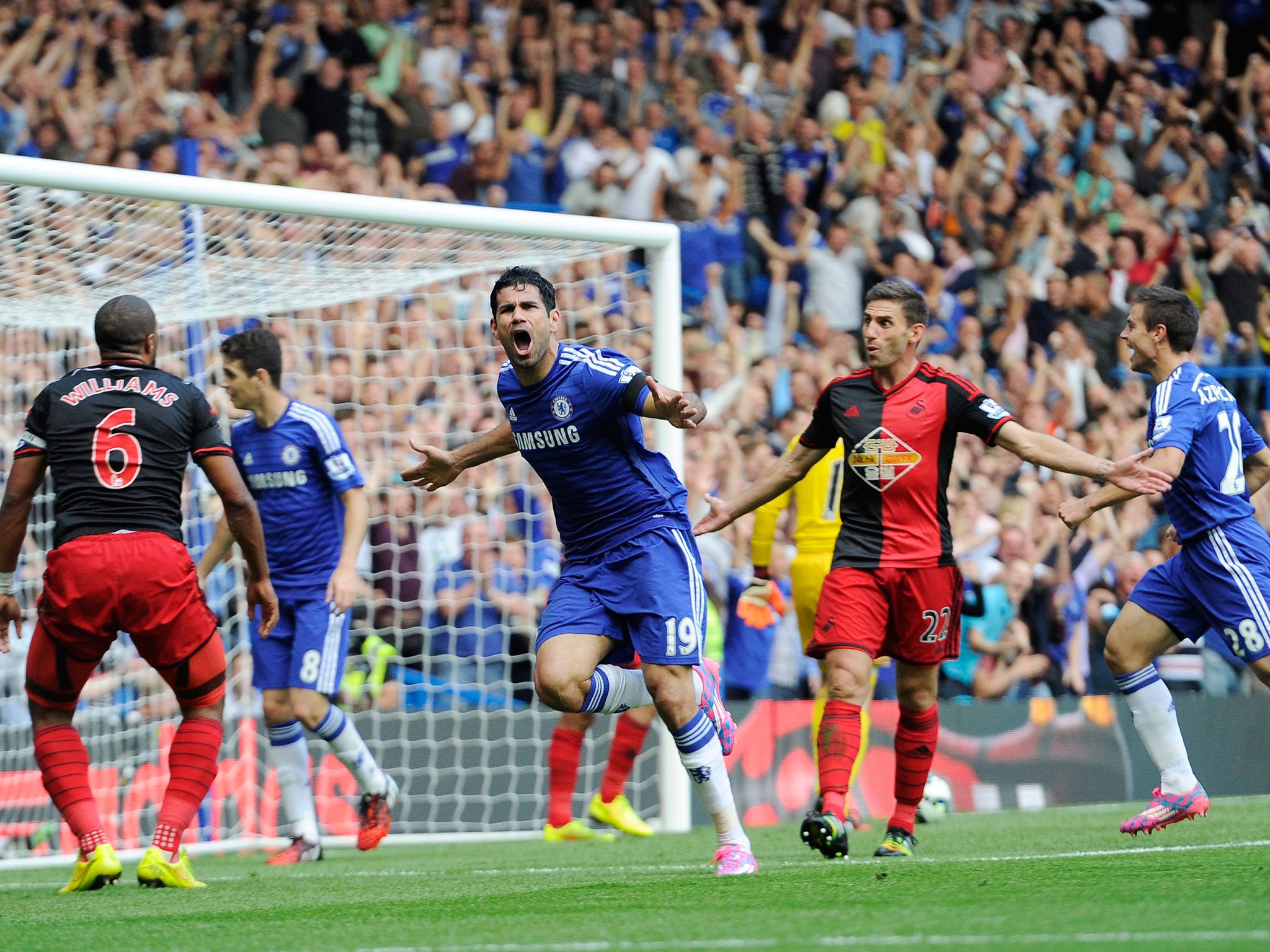 Chelsea striker Diego Costa celebrates scoring one of his hat-trick goals against Swansea