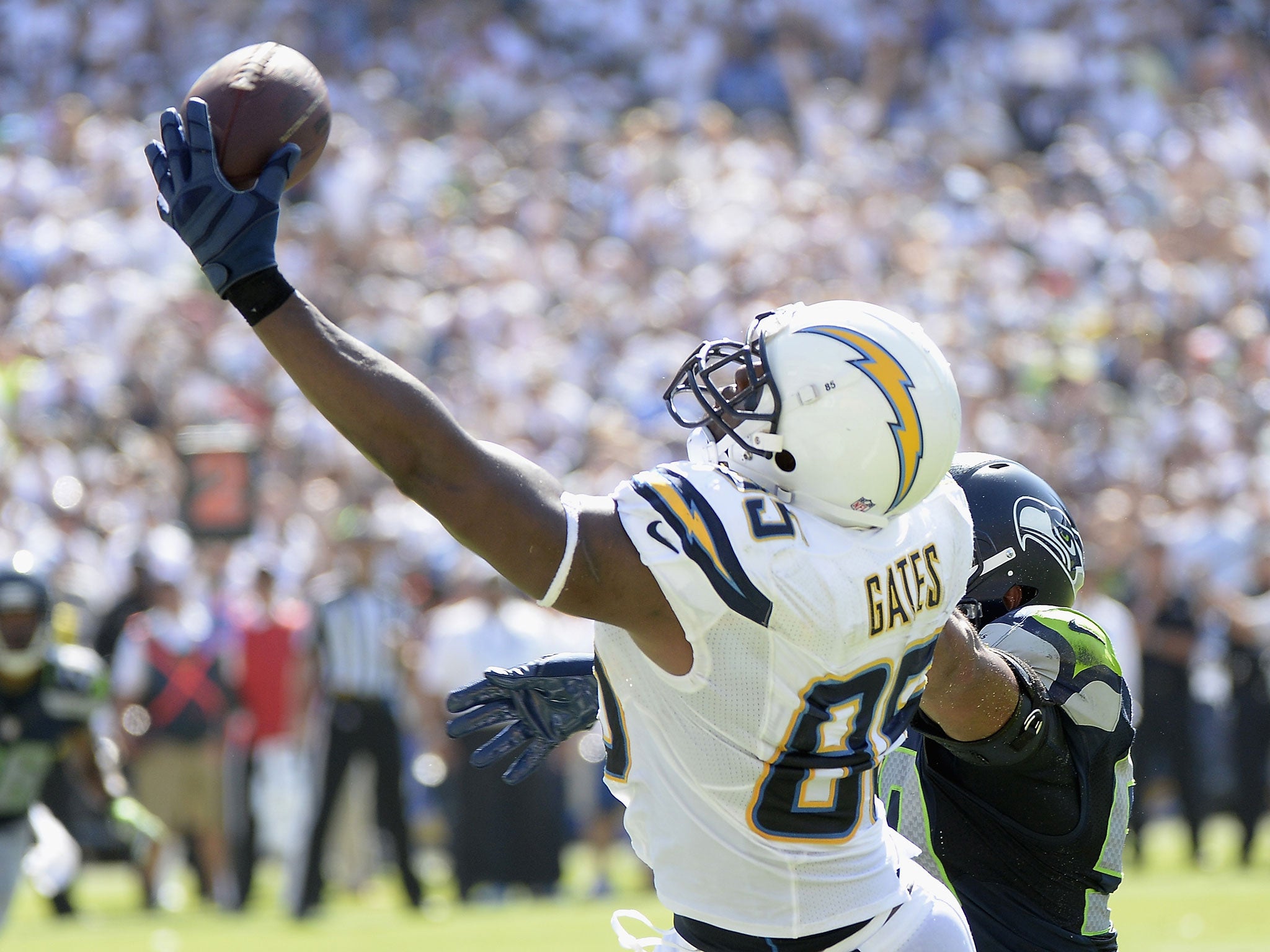 Tight end Antonio Gates reaches out to grasp a one-handed touchdown